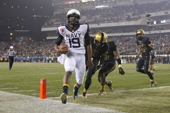 PHILADELPHIA - DECEMBER 8: Keenan Reynolds #19 of the Navy Midshipmen scores the game winning touchdown during a game against the Army Black Knights on December 8, 2012 at Lincoln Financial Field in Philadelphia, Pennsylvania. The Navy won 17-13. (Photo b