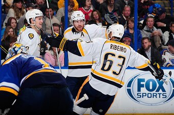 ST. LOUIS, MO - NOVEMBER 8: James Neal #18 of the Nashville Predators is congratulated by Filip Forsberg #9 and Mike Ribeiro #63 after scoring the game winning goal off of Brian Elliott #1 of the St. Louis Blues on November 8, 2014 at Scottrade Center in 