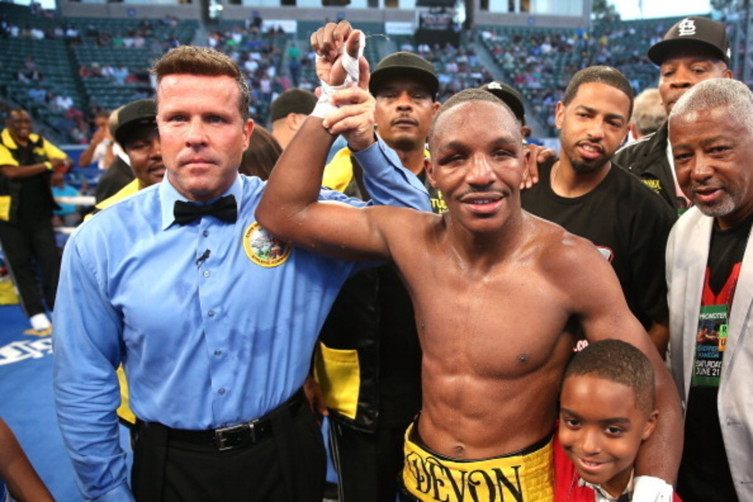LOS ANGELES, CA - JUNE 21:  Devon Alexander poses with referee Thomas Taylor after defeating Jesus Soto Karass in their superwelterweight bout at StubHub Center on June 21, 2014 in Los Angeles, California.  Alexander won in a unanimous decision.  (Photo b