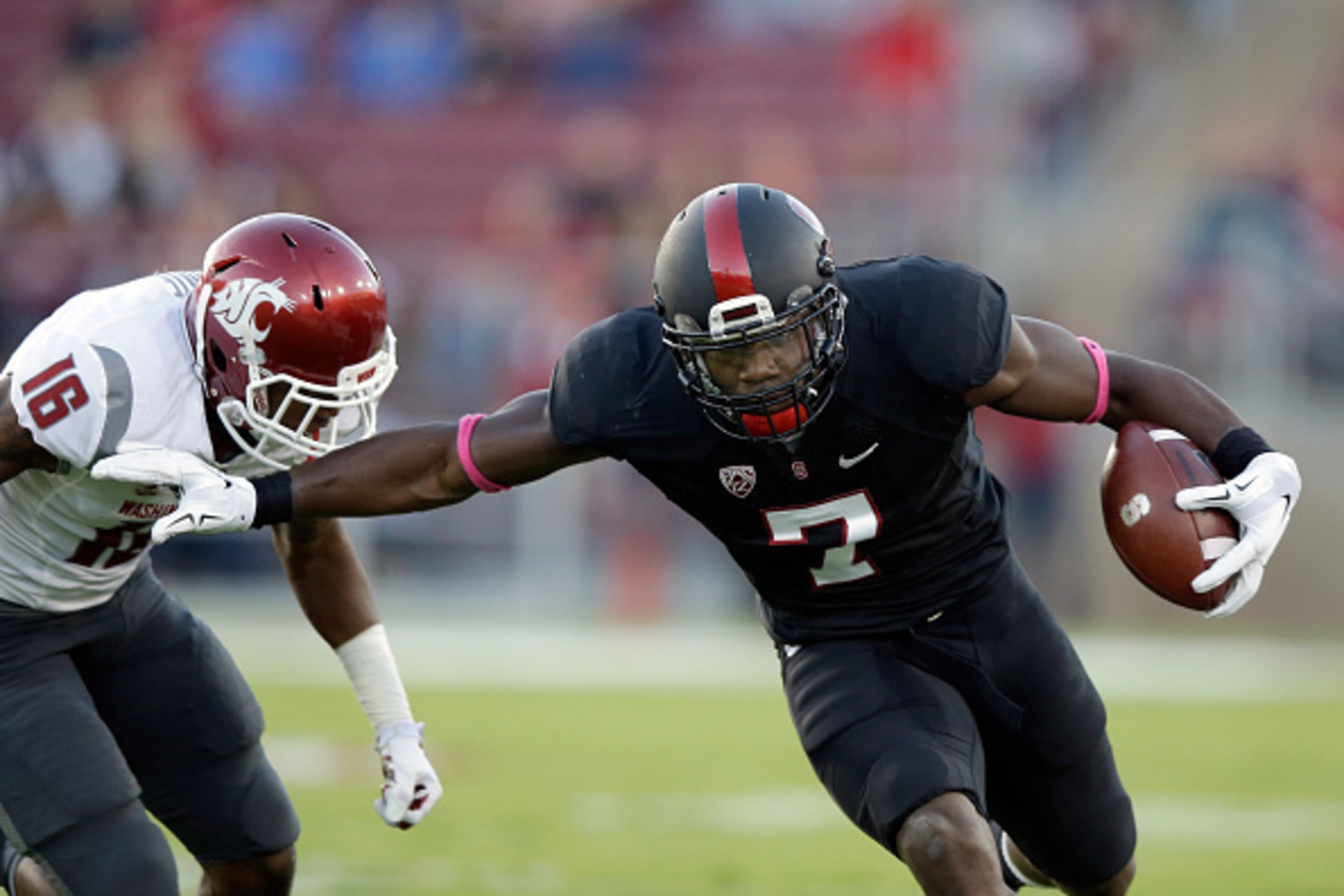 PALO ALTO, CA - OCTOBER 10:  Ty Montgomery #7 of the Stanford Cardinal tries to run away from Charleston White #16 of the Washington State Cougars at Stanford Stadium on October 10, 2014 in Palo Alto, California.  (Photo by Ezra Shaw/Getty Images)