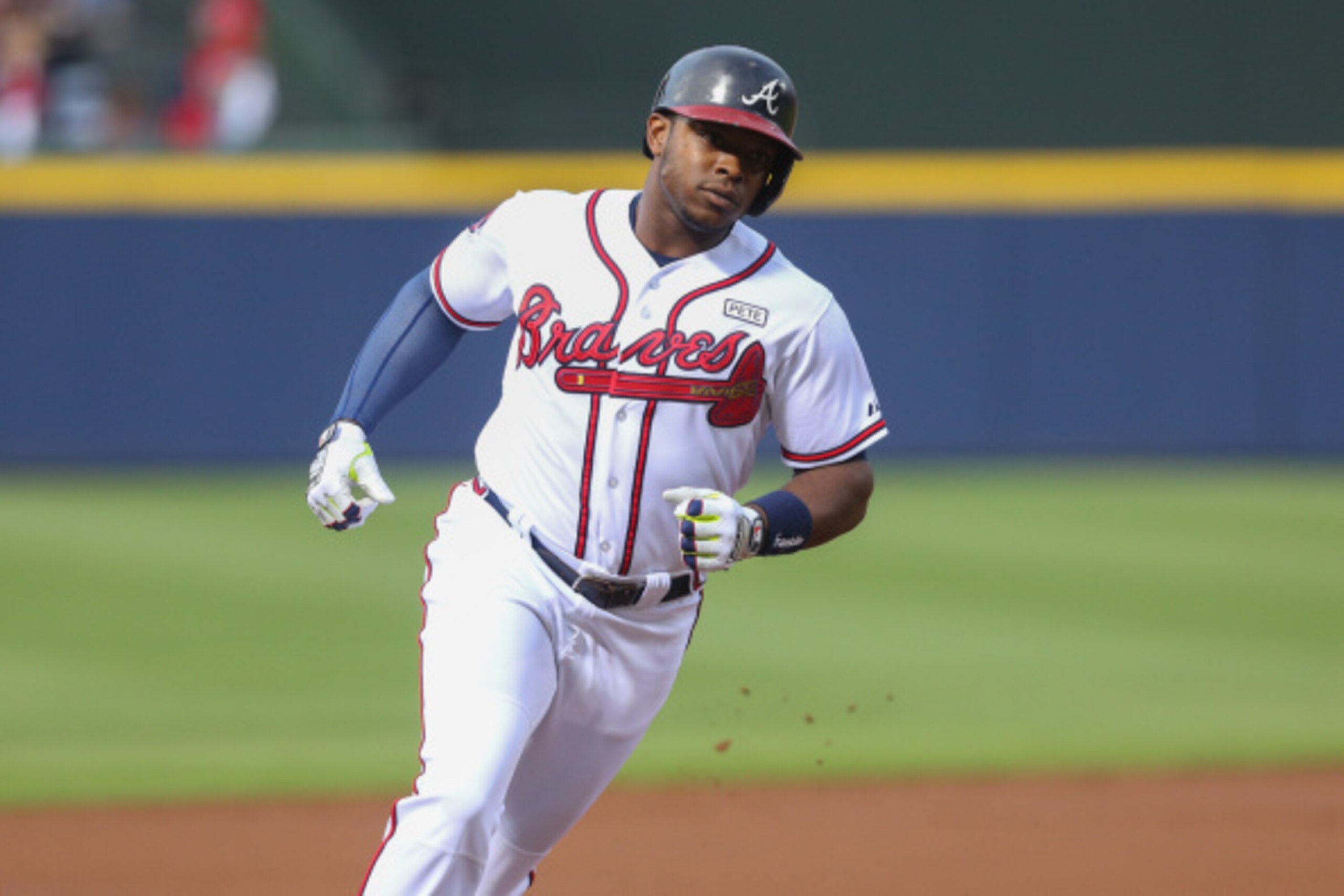 ATLANTA, GA - AUGUST 8:  Justin Upton #8 of the Atlanta Braves rounds the bases after hitting a two-run home run against the Washington Nationals during the first inning at Turner Field on August 8, 2014 in Atlanta, Georgia. (Photo by Kevin Liles/Getty Im