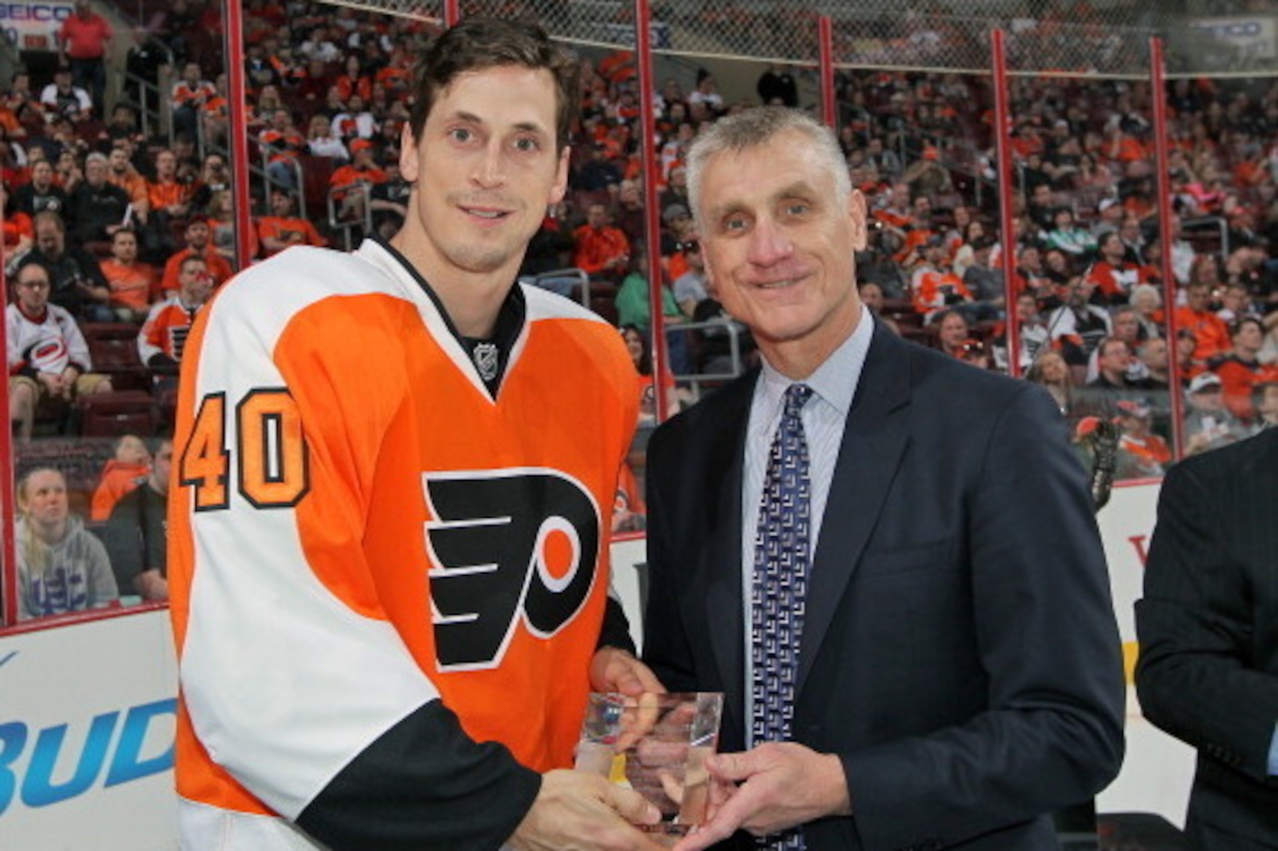 PHILADELPHIA, PA - APRIL 13:  (R) General Manager Paul Holmgren presents (L) Vincent Lecavalier #40 of the Philadelphia Flyers with his award from Commissioner Gary Bettmen for his 400 NHL goal prior to their game against the Carolina Hurricanes on April 