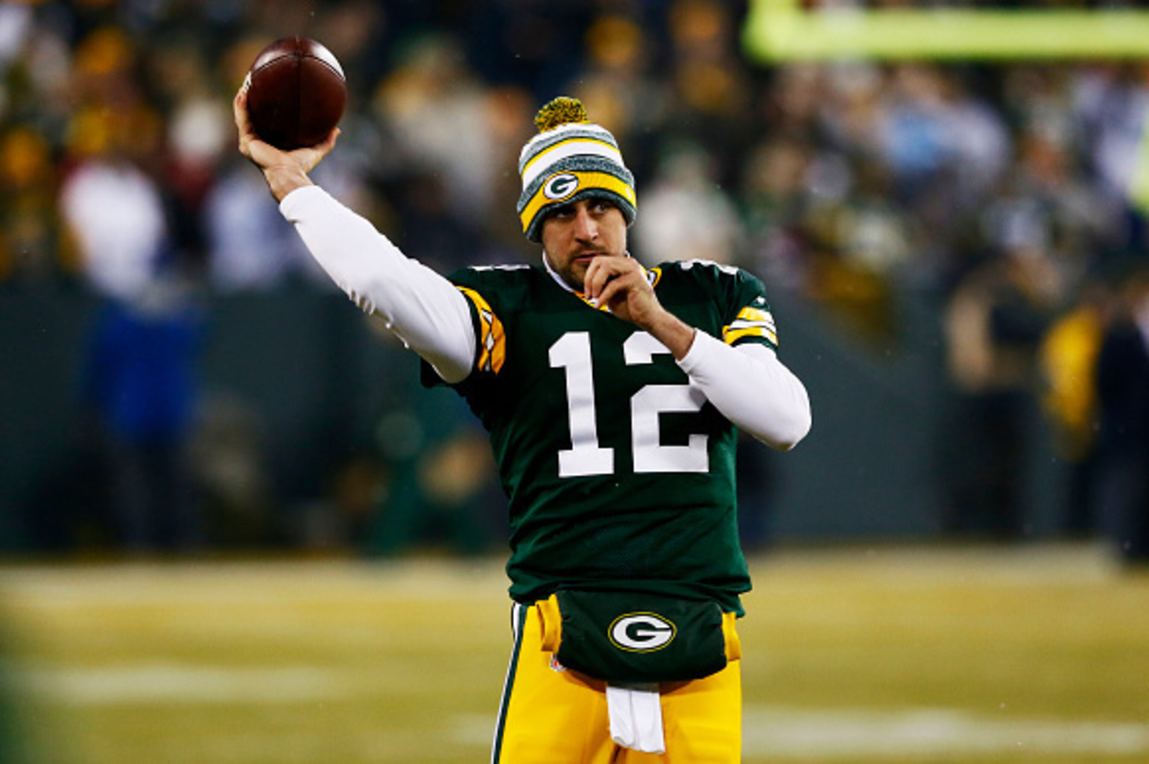 GREEN BAY, WI - DECEMBER 08:  Aaron Rodgers #12 of the Green Bay Packers warms up prior to their game against the Atlanta Falcons at Lambeau Field on December 8, 2014 in Green Bay, Wisconsin.  (Photo by Kevin C. Cox/Getty Images)