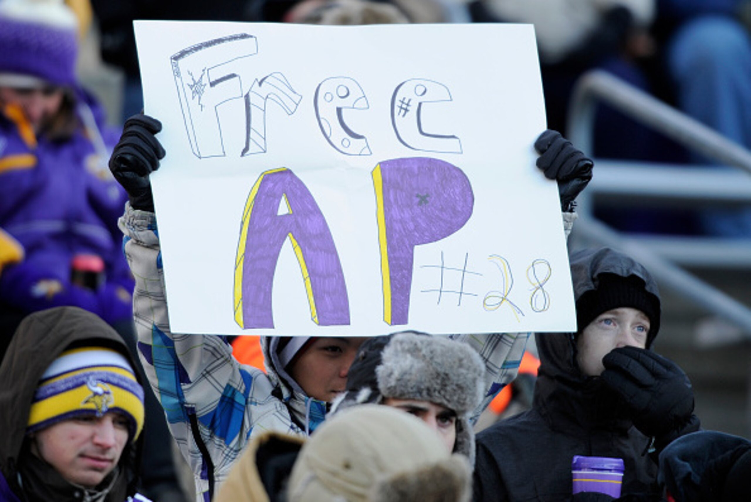 MINNEAPOLIS, MN - NOVEMBER 30: A fan holds up a sign in support of Adrian Peterson #28 of the Minnesota Vikings during the third quarter of the game against the Carolina Panthers on November 30, 2014 at TCF Bank Stadium in Minneapolis, Minnesota. The Viki