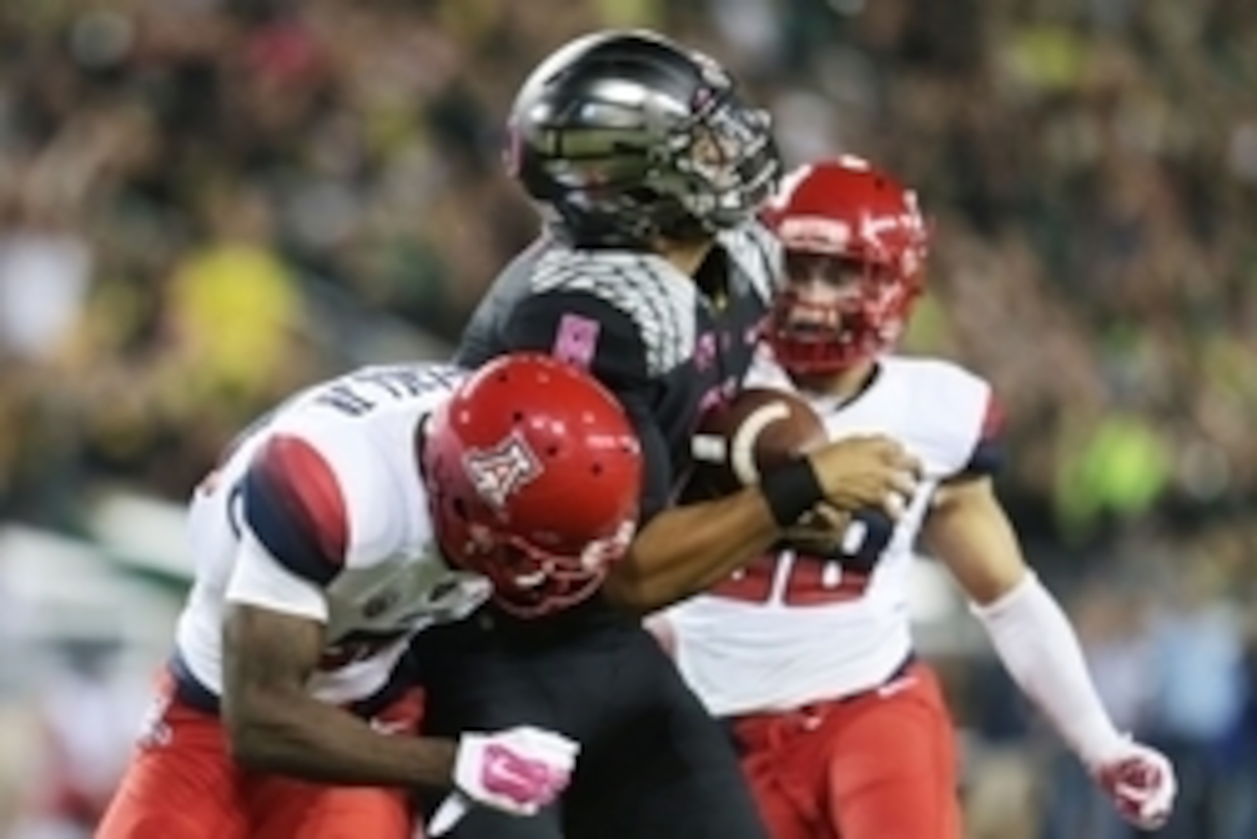 Oct 2, 2014; Eugene, OR, USA; Oregon Ducks quarterback Marcus Mariota (8) makes a catch thrown by Oregon Ducks running back Royce Freeman (21) for a touchdown in the second quarter against the Arizona Wildcats at Autzen Stadium. Mandatory Credit: Scott Ol