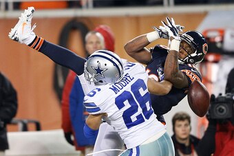 CHICAGO, IL - DECEMBER 4: Marquess Wilson #10 of the Chicago Bears cannot come down with the ball as he is covered by Sterling Moore #26 of the Dallas Cowboys during the third quarter of a game at Soldier Field on December 4, 2014 in Chicago, Illinois. Th
