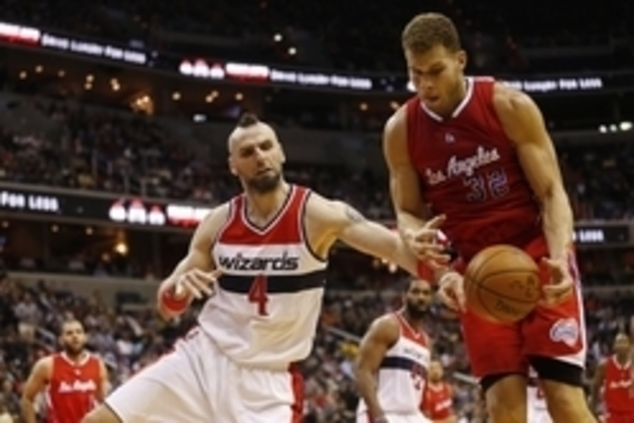 Dec 12, 2014; Washington, DC, USA; Washington Wizards center Marcin Gortat (4) and Los Angeles Clippers forward Blake Griffin (32) battle for a loose ball in the third quarter at Verizon Center. The Wizards won 104-96. Mandatory Credit: Geoff Burke-USA TO