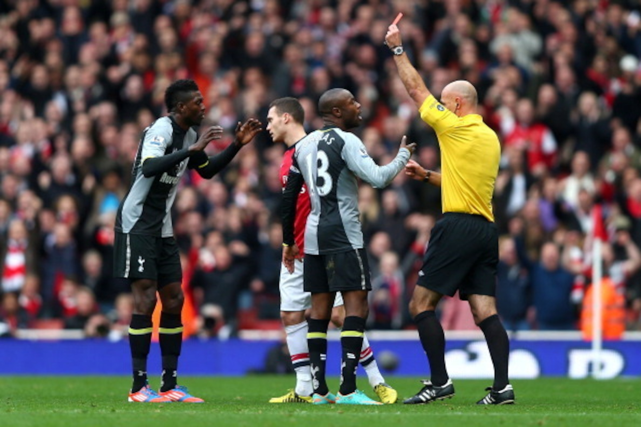 LONDON, ENGLAND - NOVEMBER 17:  William Gallas protests to referee Howard Webb as team-mate Emmanuel Adebayor of Tottenham Hotspur (L) is shown a red card during the Barclays Premier league match between Arsenal and Tottenham Hotspur at Emirates Stadium o