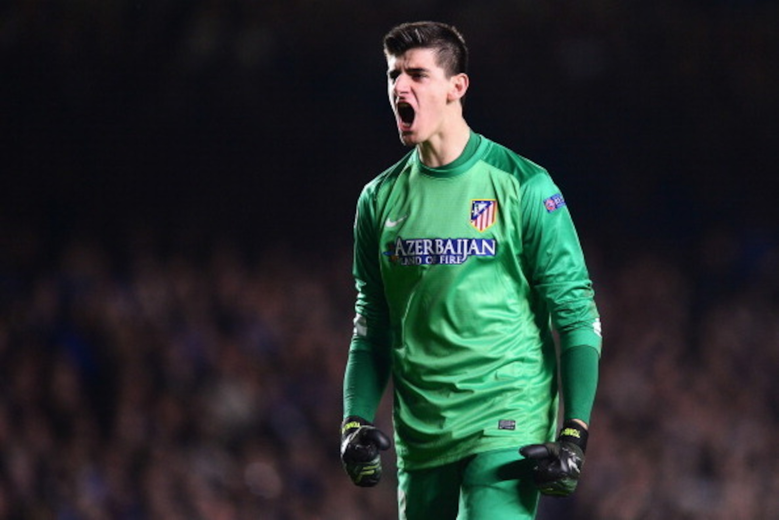 LONDON, ENGLAND - APRIL 30: Goalkeeper Thibaut Courtois of Club Atletico de Madrid celebrates a goal during the UEFA Champions League semi-final second leg match between Chelsea and Club Atletico de Madrid at Stamford Bridge on April 30, 2014 in London, E