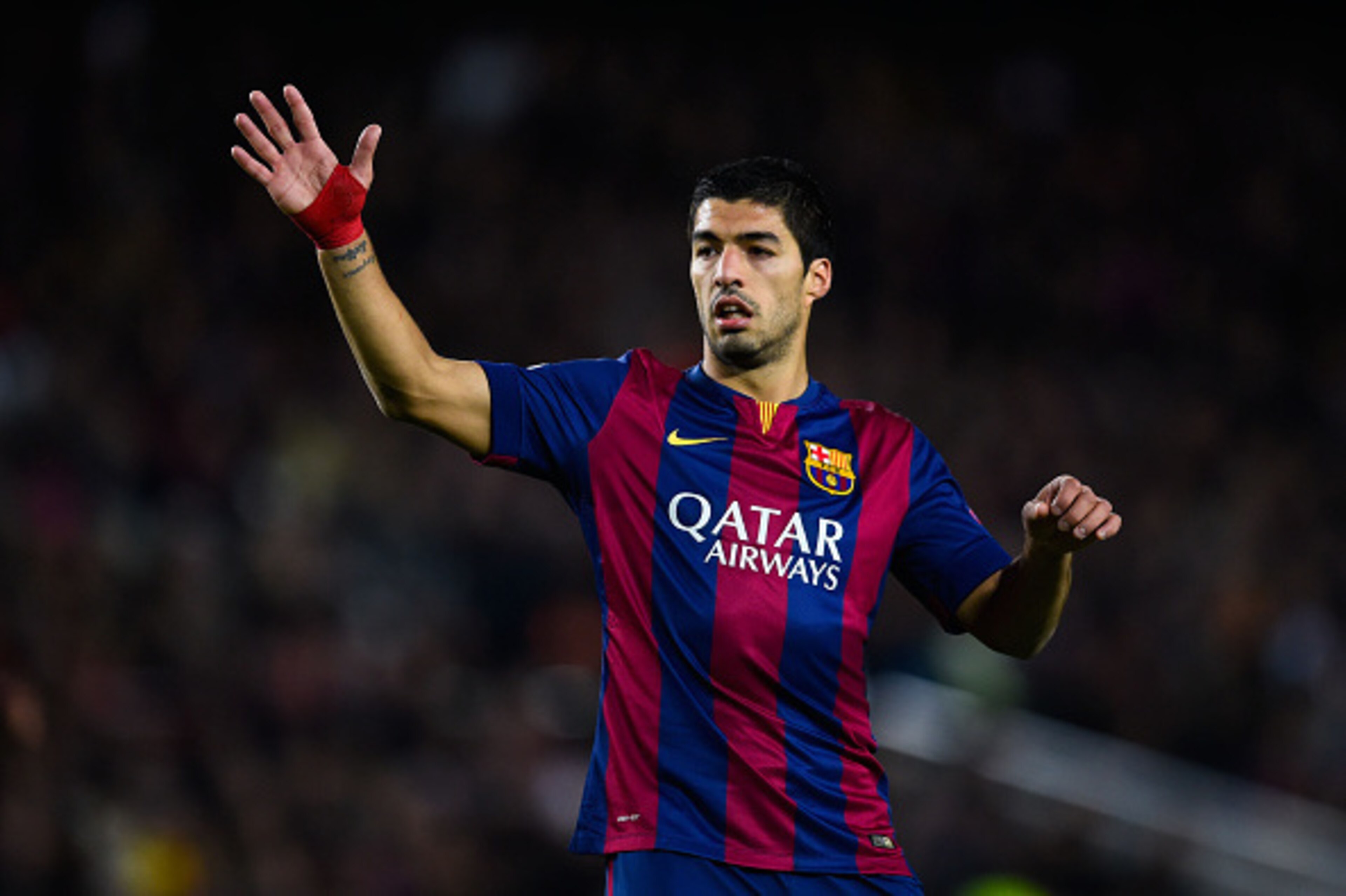 BARCELONA, SPAIN - DECEMBER 10:  Luis Suarez of FC Barcelona reacts during the UEFA Champions League group F match between FC Barcelona and Paris Saint-Germanin FC at Camp Nou Stadium on December 10, 2014 in Barcelona, Spain.  (Photo by David Ramos/Getty 