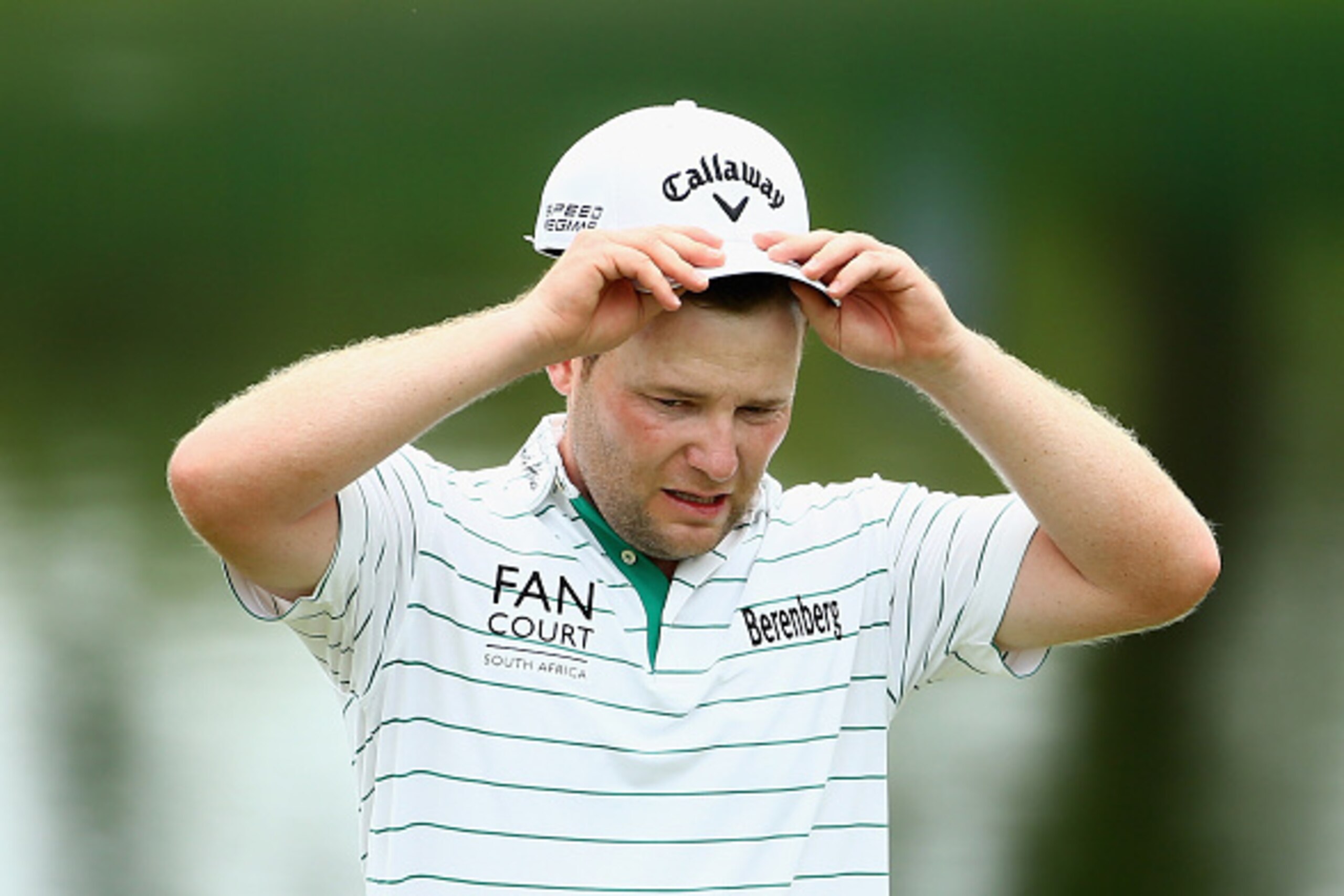 MALELANE, SOUTH AFRICA - DECEMBER 12:  Branden Grace of South Africa walks off the 9th green after compleating his round during the second round of the Alfred Dunhill Championship at Leopard Creek Country Golf Club on December 12, 2014 in Malelane, South 