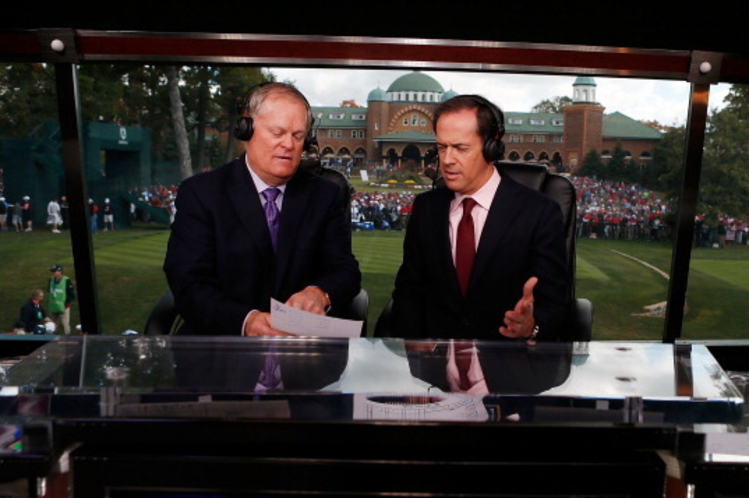 MEDINAH, IL - SEPTEMBER 30:  Johnny Miller (L) and Dan Hicks are seen on the NBC set during the Singles Matches for The 39th Ryder Cup at Medinah Country Club on September 30, 2012 in Medinah, Illinois.  (Photo by Scott Halleran/Getty Images)