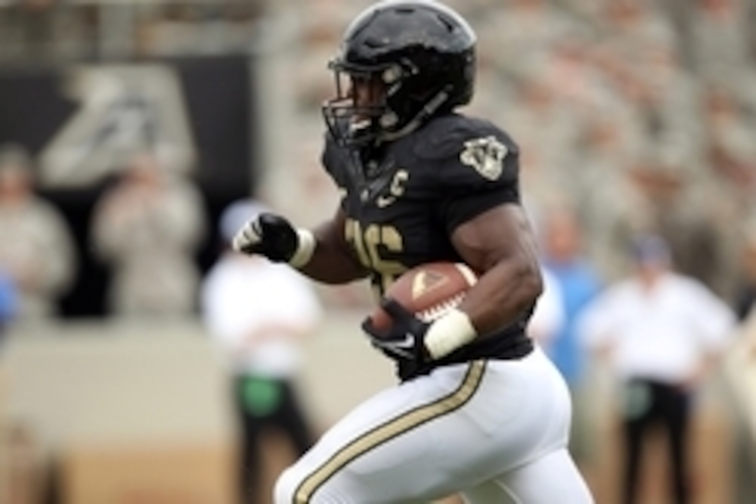 Sep 6, 2014; West Point, NY, USA; Army Black Knights fullback Larry Dixon (26) runs for a touchdown during the second half at Michie Stadium. Mandatory Credit: Danny Wild-USA TODAY Sports