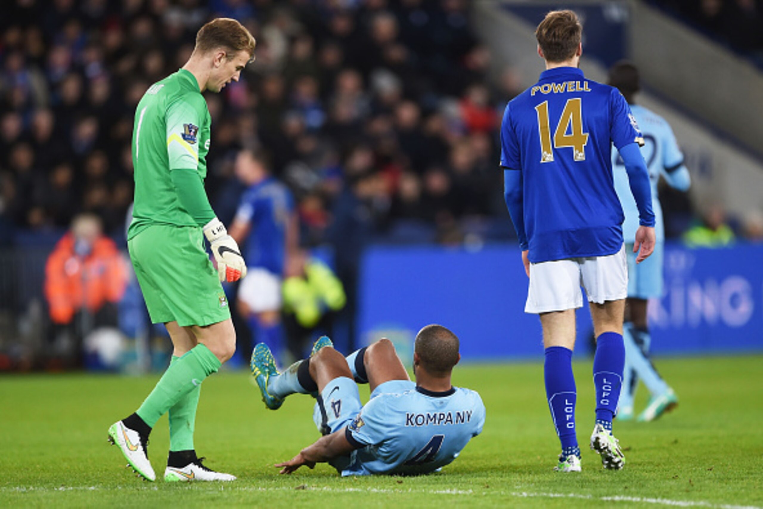 LEICESTER, ENGLAND - DECEMBER 13:  Vincent Kompany of Manchester City goes down injured during the Barclays Premier League match between Leicester City and Manchester City at The King Power Stadium on December 13, 2014 in Leicester, England.  (Photo by Mi