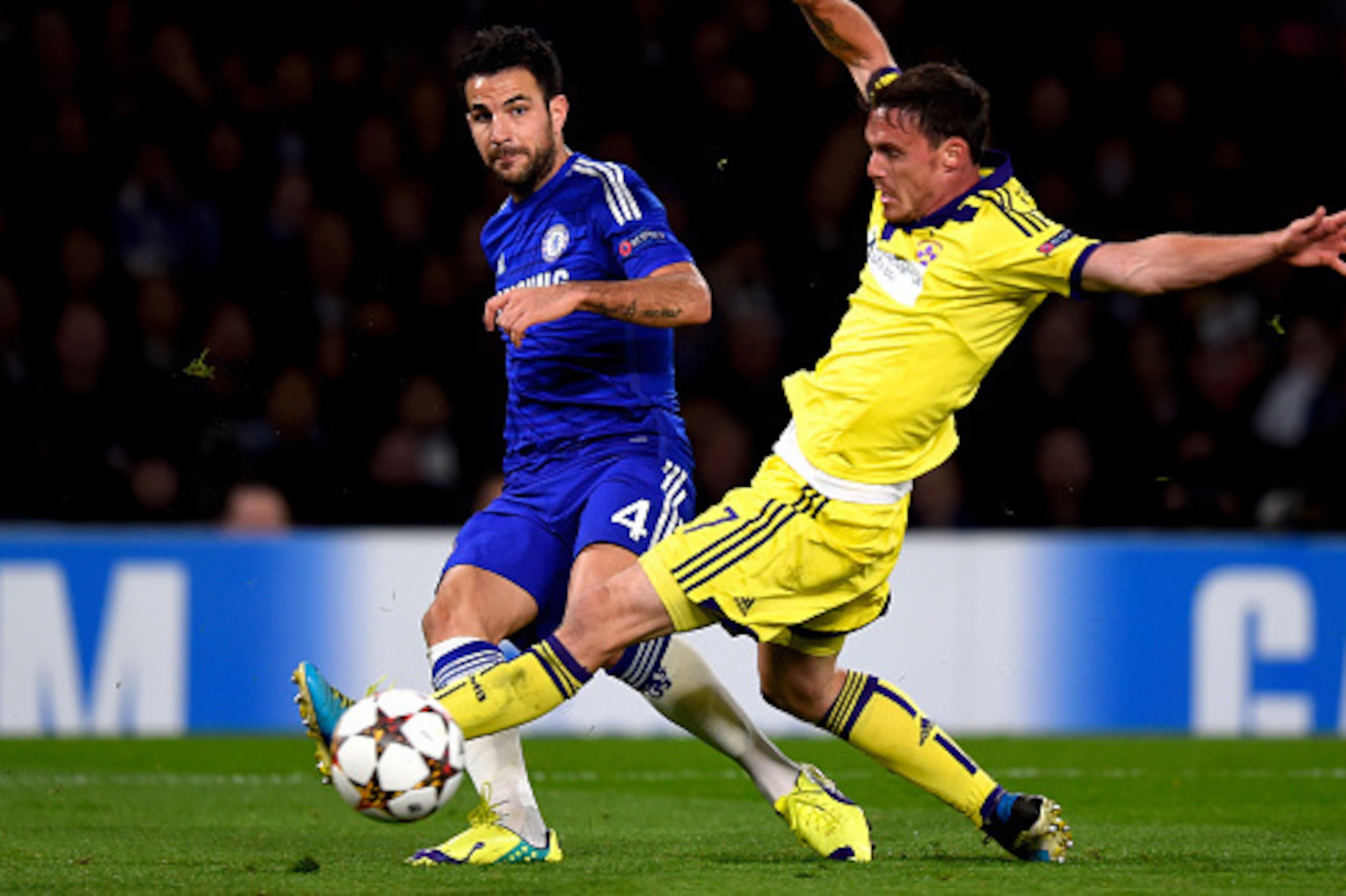 LONDON, ENGLAND - OCTOBER 21:  Cesc Fabregas of Chelsea crosses the ball past Ales Mejac of Maribor during the UEFA Champions League Group G match between Chelsea FC and NK Maribor at Stamford Bridge on October 21, 2014 in London, United Kingdom.  (Photo 