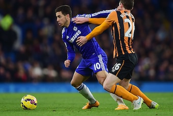 LONDON, ENGLAND - DECEMBER 13:  Eden Hazard of Chelsea holds off Andrew Robertson of Hull City during the Barclays Premier League match between Chelsea and Hull City at Stamford Bridge on December 13, 2014 in London, England.  (Photo by Jamie McDonald/Get