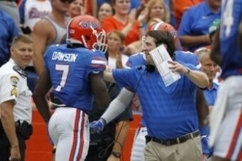Sep 6, 2014; Gainesville, FL, USA;Florida Gators head coach Will Muschamp celebrates with defensive back Duke Dawson (7) after he recovered the ball and ran it back for a touchdown during the second half against the Eastern Michigan Eagles at Ben Hill Gri