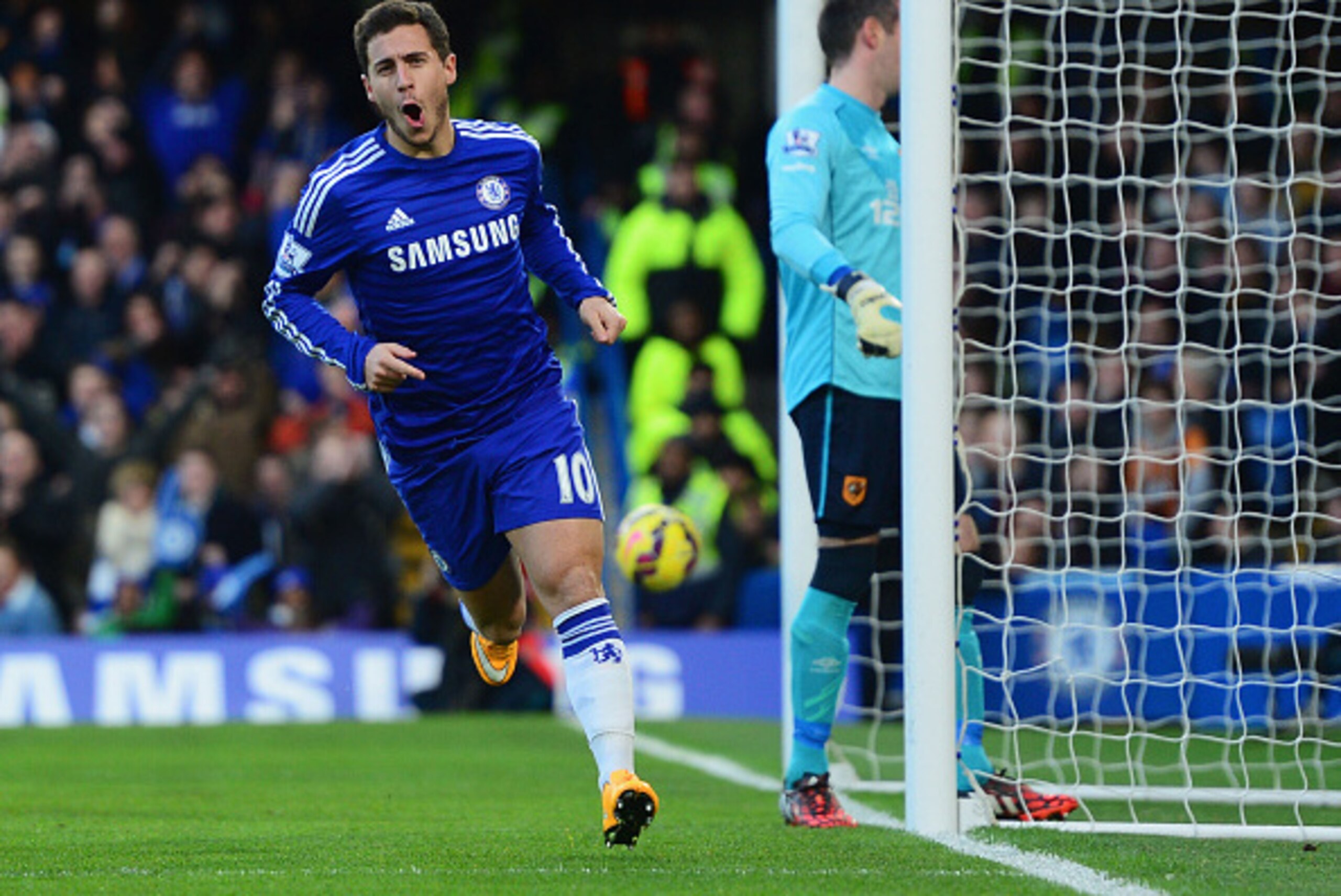 LONDON, ENGLAND - DECEMBER 13:  Despair for Allan McGregor of Hull City as Eden Hazard of Chelsea (10) celebrates as he scores their first goal  during the Barclays Premier League match between Chelsea and Hull City at Stamford Bridge on December 13, 2014