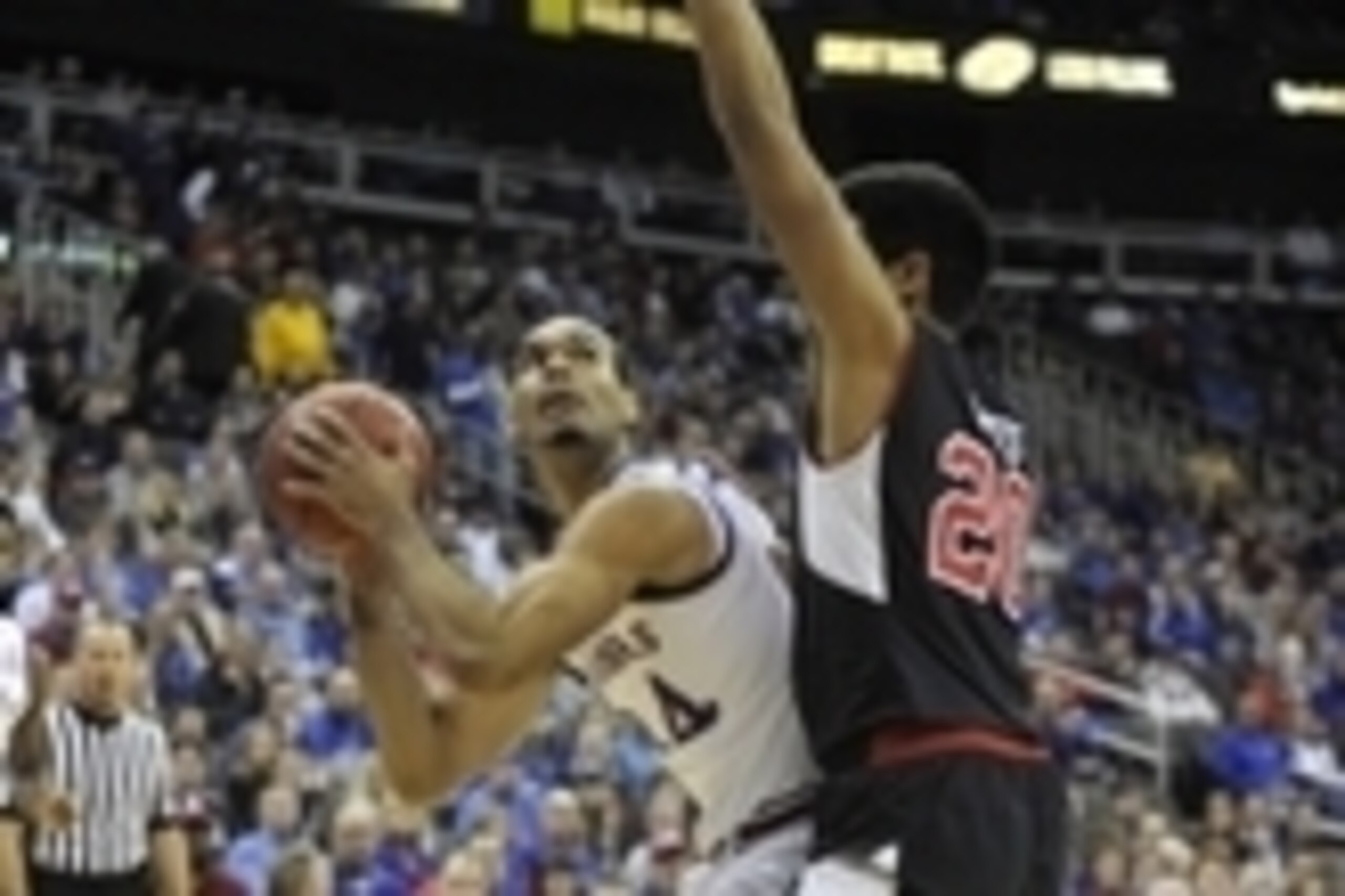 Dec 13, 2014; Kansas City, MO, USA; Kansas Jayhawks forward Perry Ellis (34) drives to the basket against Utah Utes forward Chris Reyes (20) in the first half at Sprint Center. Mandatory Credit: John Rieger-USA TODAY Sports