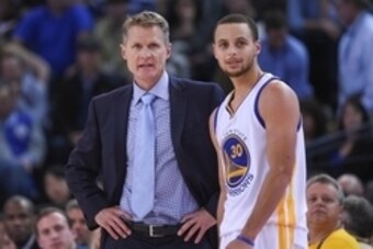 December 2, 2014; Oakland, CA, USA; Golden State Warriors head coach Steve Kerr (left) talks to guard Stephen Curry (30) during the fourth quarter against the Orlando Magic at Oracle Arena. The Warriors defeated the Magic 98-97. Mandatory Credit: Kyle Ter