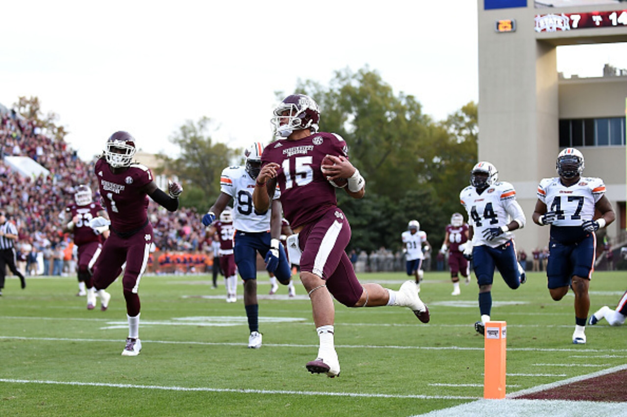 STARKVILLE, MS - NOVEMBER 08:  Dak Prescott #15 of the Mississippi State Bulldogs runs for a touchdown during the second quarter of a game against the Tennessee Martin Skyhawks at Davis Wade Stadium on November 8, 2014 in Starkville, Mississippi.  (Photo 