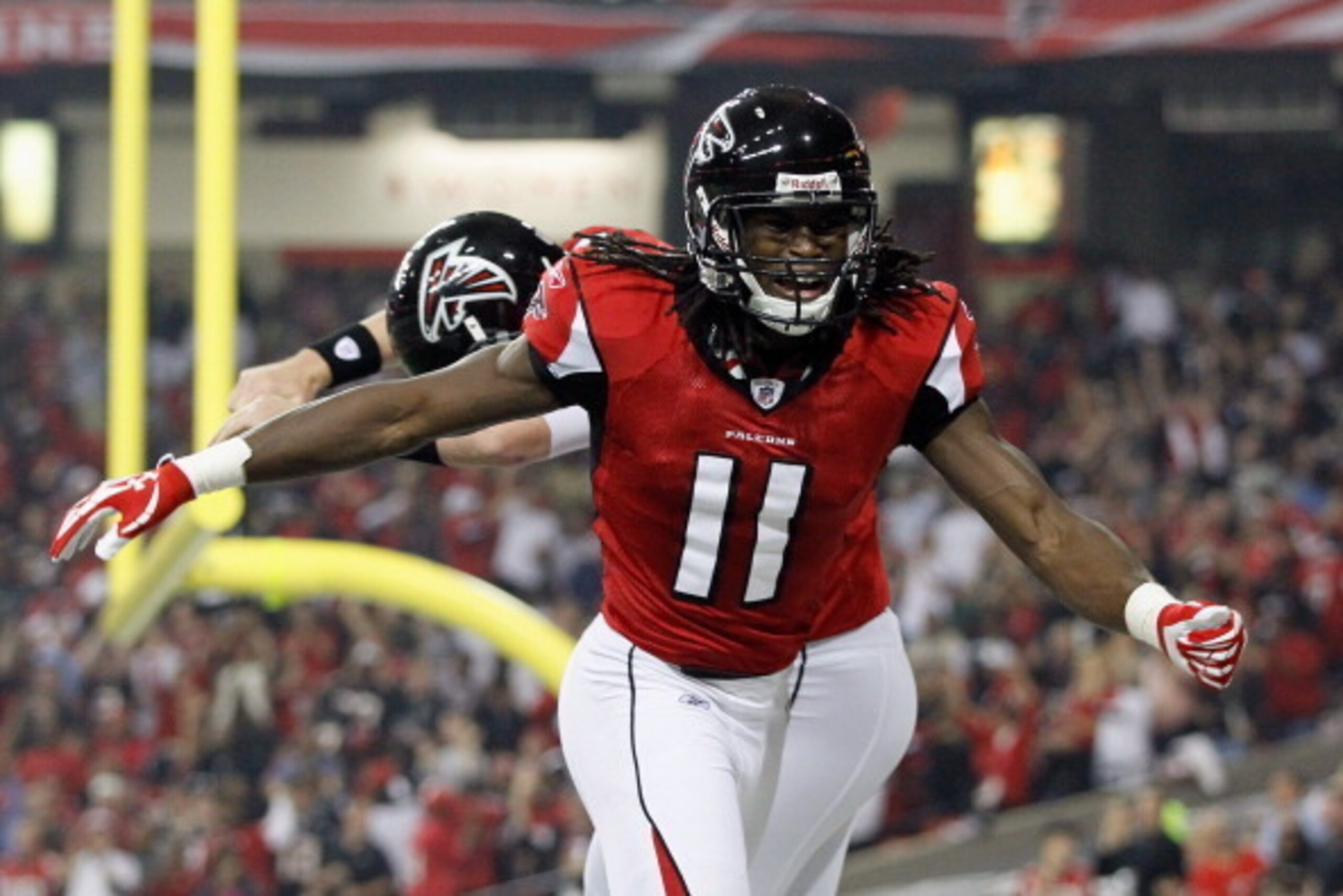 ATLANTA, GA - DECEMBER 15:  Julio Jones #11 and Matt Ryan of the Atlanta Falcons celebrate after Jones scored a 29-yard touchdown reception in the first quarter against the Jacksonville Jaguars at the Georgia Dome on December 15, 2011 in Atlanta, Georgia.