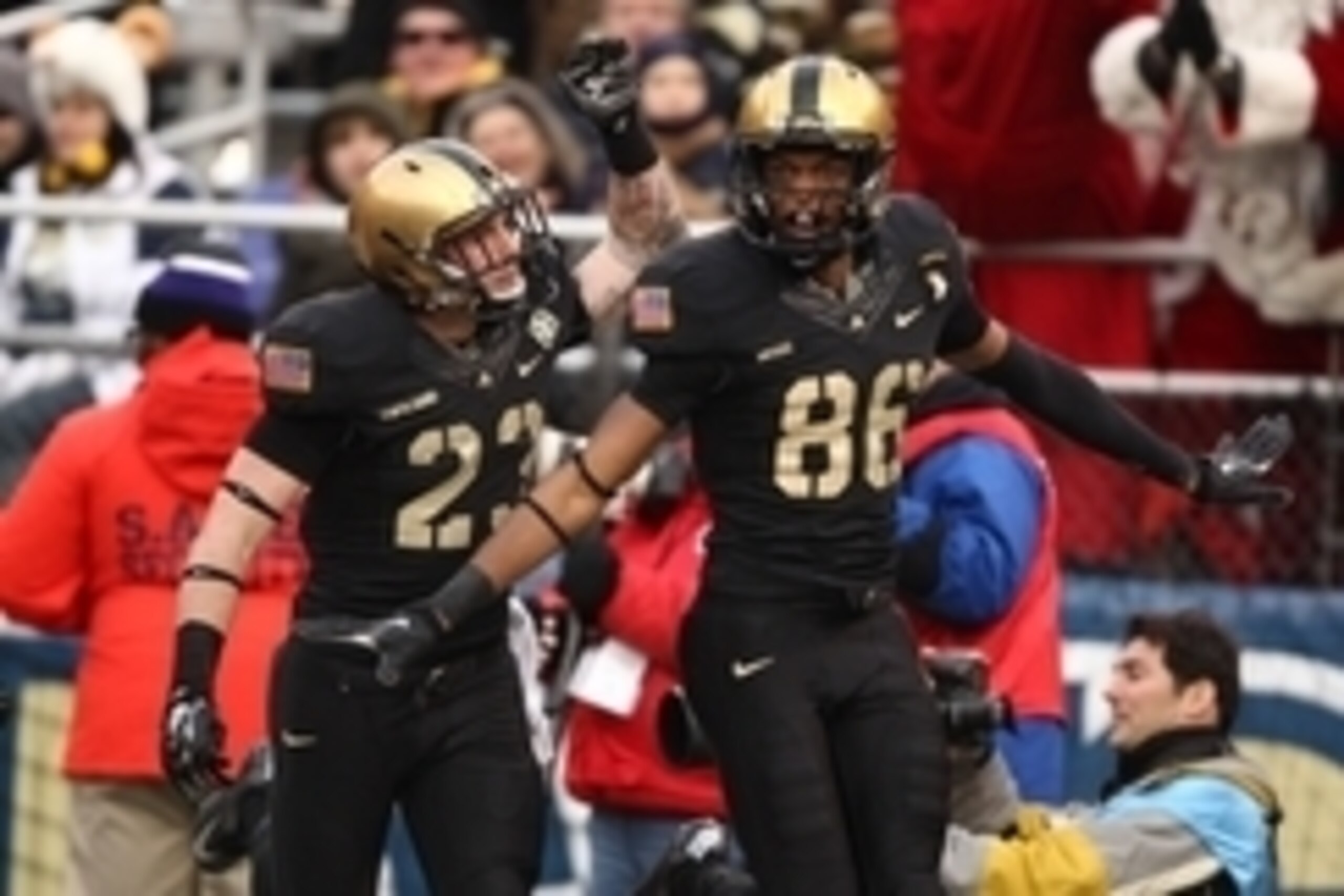 Dec 13, 2014; Baltimore, MD, USA; Army Black Knights wide receiver Xavier Moss (86) celebrates with Army Black Knights defensive back Rhyan England (23) after scoring a touchdown on a blocked punt against the Navy Midshipmen during the first half at M&T B