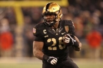 Dec 13, 2014; Baltimore, MD, USA; Army Black Knights fullback Larry Dixon (26) runs after a catch during the second half against the Navy Midshipmen at M&T Bank Stadium. Mandatory Credit: Danny Wild-USA TODAY Sports