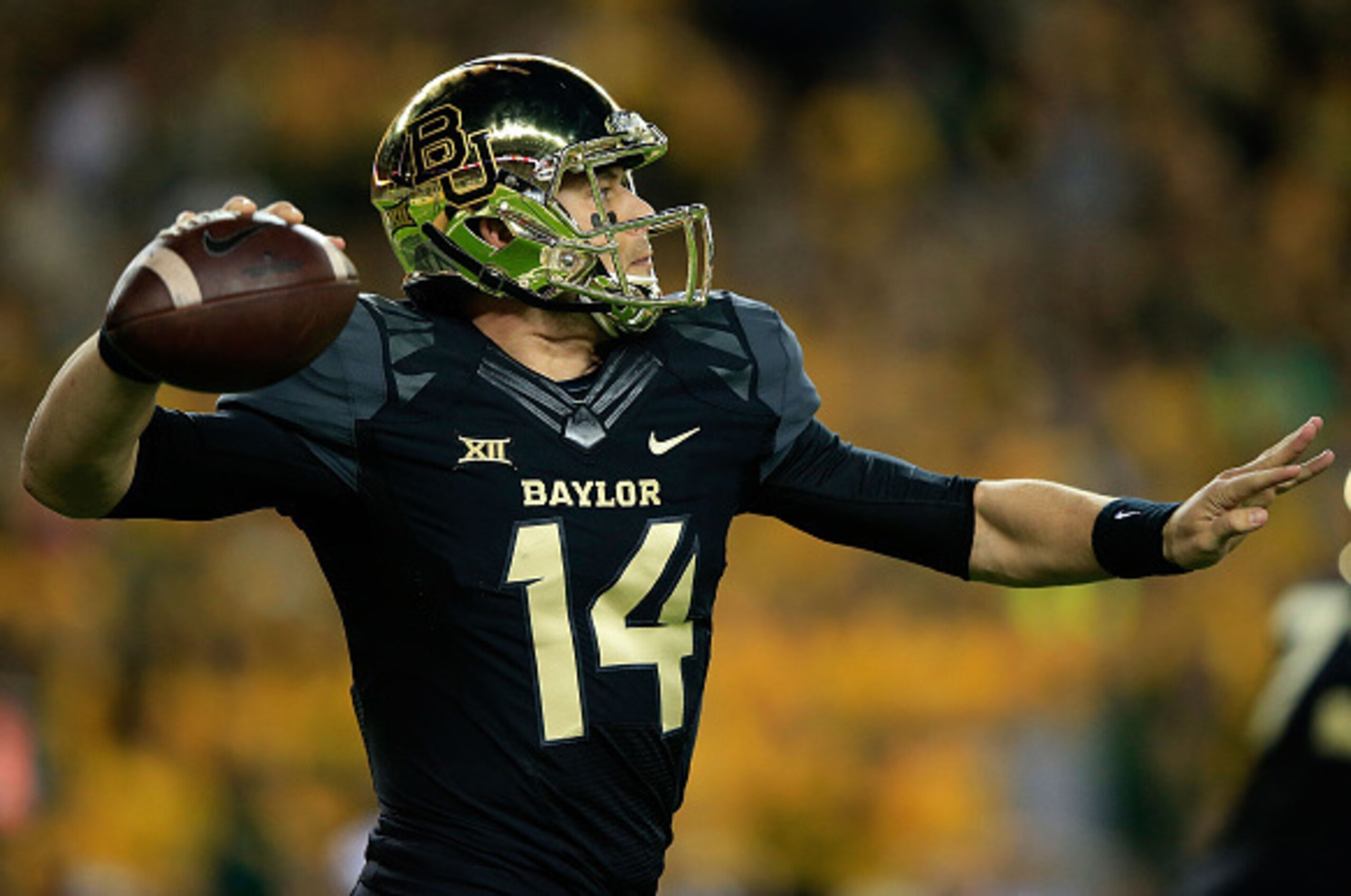 WACO, TX - DECEMBER 06:  Bryce Petty #14 of the Baylor Bears passes against the Kansas State Wildcats during the first half of the game on December 6, 2014  at McLane Stadium in Waco, Texas.  (Photo by Jamie Squire/Getty Images)