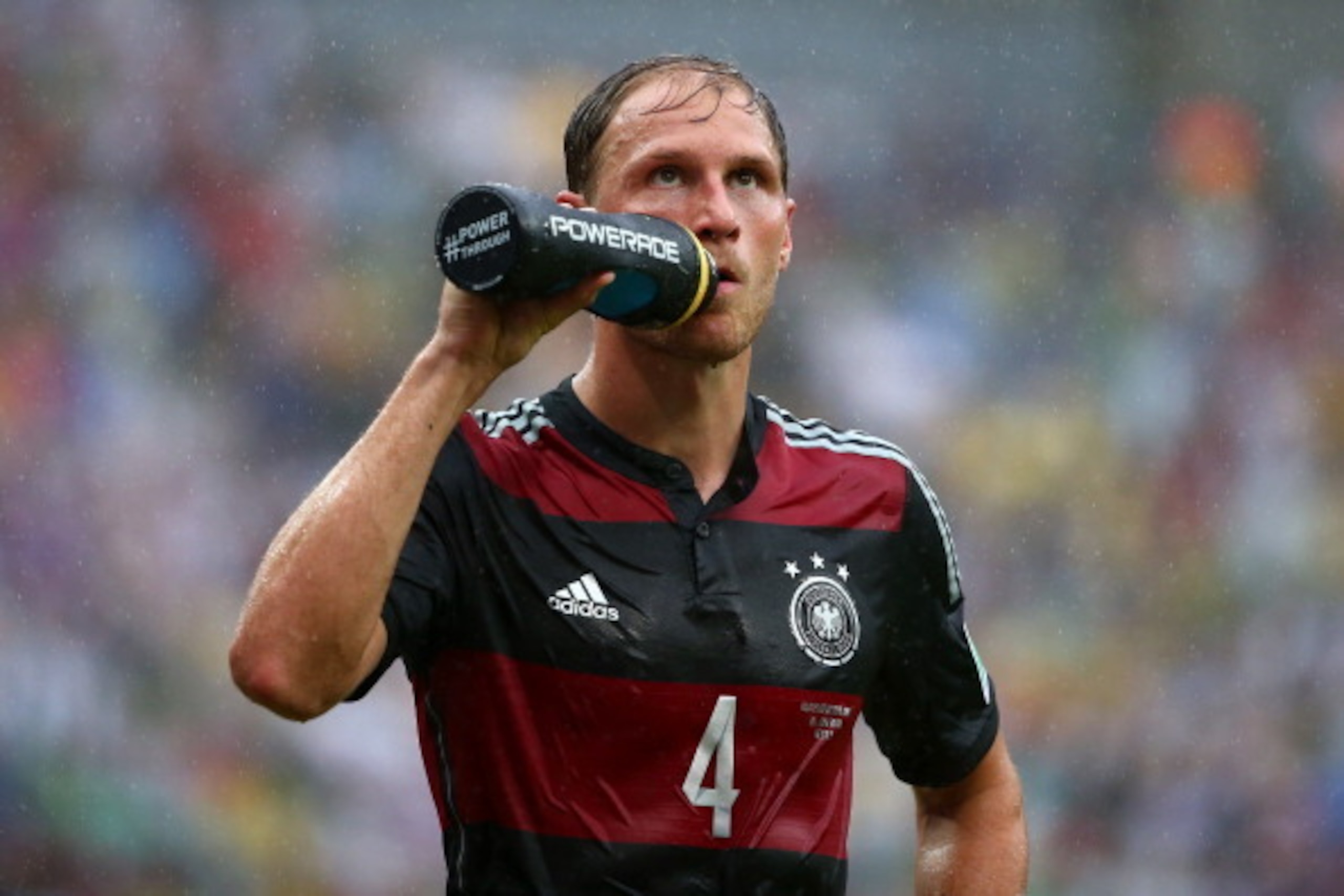 RECIFE, BRAZIL - JUNE 26: Benedikt Hoewedes of Germany takes on fluids during the 2014 FIFA World Cup Brazil group G match between the United States and Germany at Arena Pernambuco on June 26, 2014 in Recife, Brazil.  (Photo by Robert Cianflone/Getty Imag