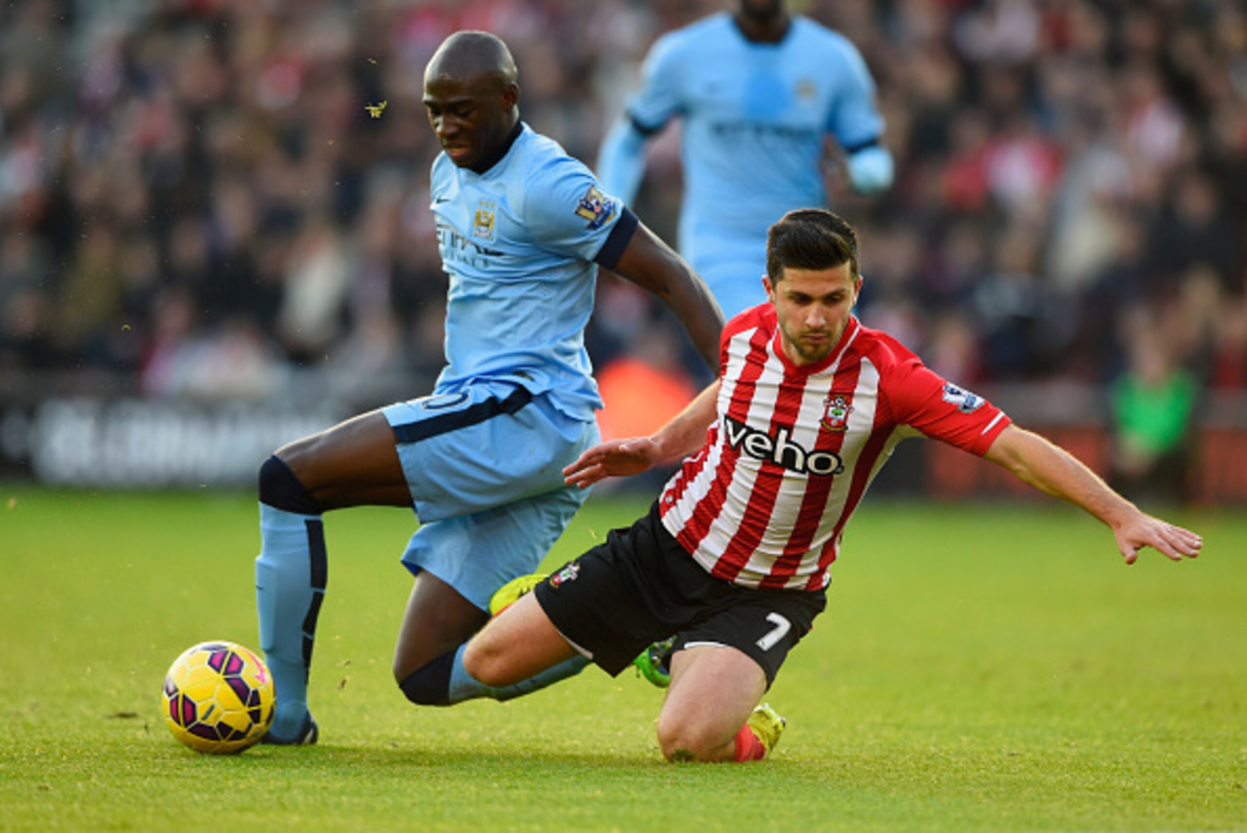 SOUTHAMPTON, ENGLAND - NOVEMBER 30:  Eliaquim Mangala of Manchester City challenges Shane Long of Southampton during the Barclays Premier League match between Southampton and Manchester City at St Mary's Stadium on November 30, 2014 in Southampton, Englan