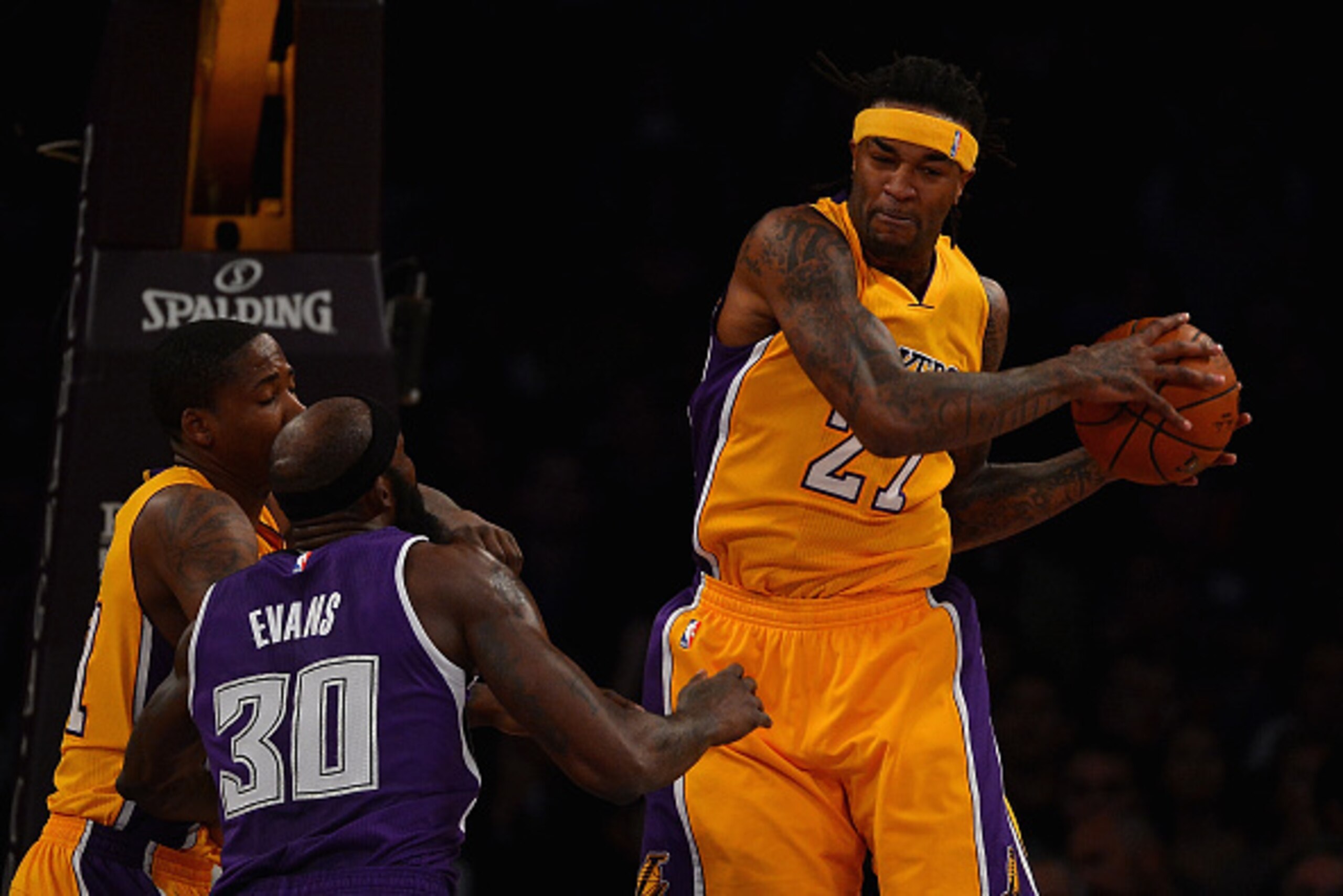 LOS ANGELES, CA - DECEMBER 09:   Jordan Hill #27 of the Los Angeles Lakers gets the rebound over Reggie Evans #30 of the Sacramento Kings during a game at Staples Center on December 9, 2014 in Los Angeles, California.   NOTE TO USER: User expressly acknow
