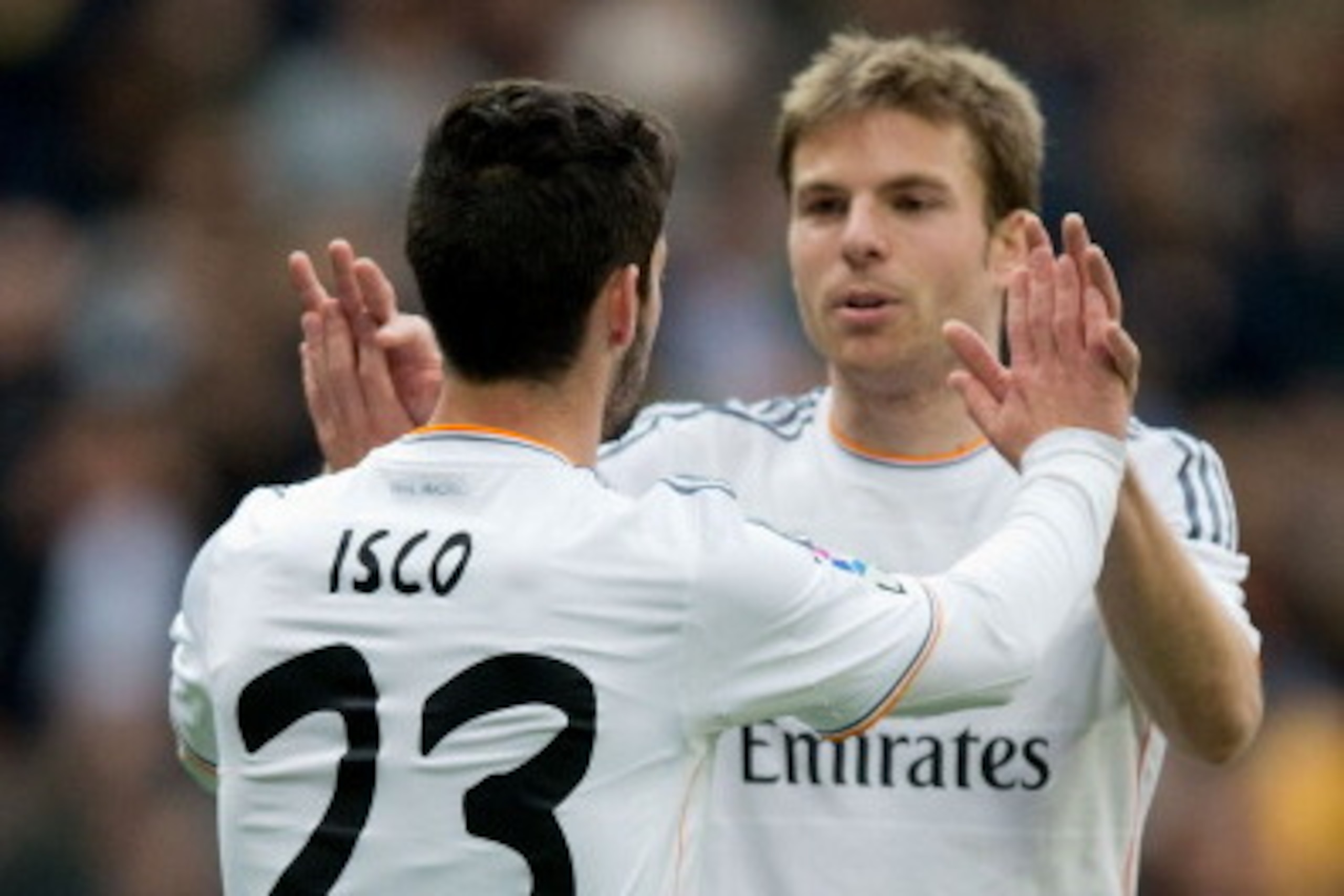 MADRID, SPAIN - FEBRUARY 22:  Isco (L) of Real Madrid CF celebrates scoring their third goal with teammate Asier Illarramendi (R) during the La Liga match between Real Madrid CF and Elche CF at Estadio Santiago Bernabeu on February 22, 2014 in Madrid, Spa