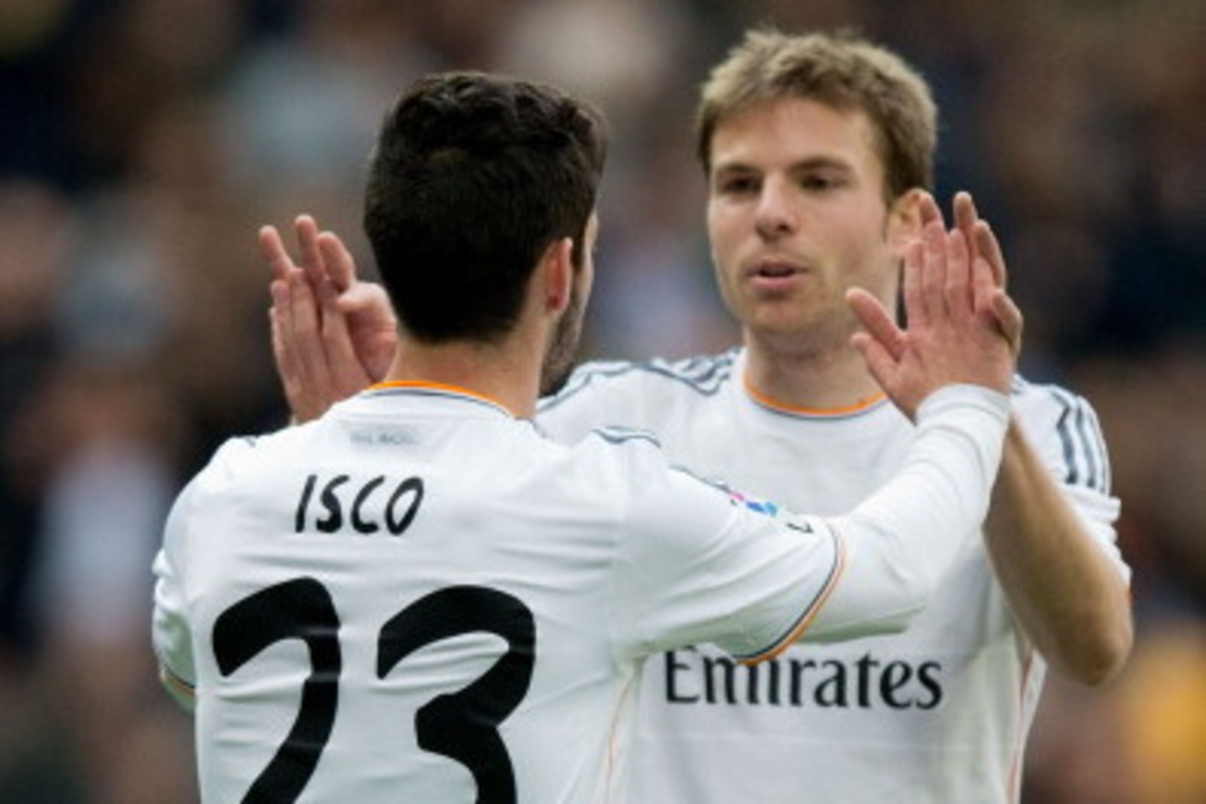 MADRID, SPAIN - FEBRUARY 22:  Isco (L) of Real Madrid CF celebrates scoring their third goal with teammate Asier Illarramendi (R) during the La Liga match between Real Madrid CF and Elche CF at Estadio Santiago Bernabeu on February 22, 2014 in Madrid, Spa