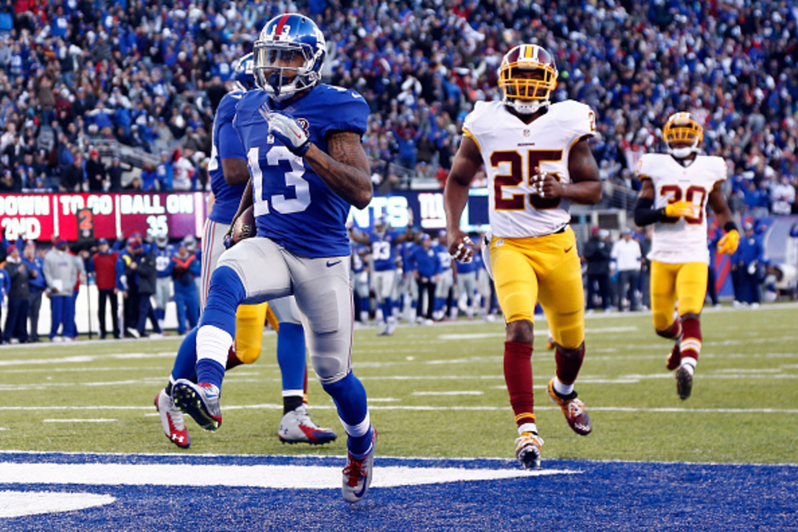 EAST RUTHERFORD, NJ - DECEMBER 14: Odell Beckham Jr. #13 of the New York Giants scores a 35 yard touchdown in the third quarter against the Washington Redskins during their game at MetLife Stadium on December 14, 2014 in East Rutherford, New Jersey. (Ph EAST RUTHERFORD, NJ - DECEMBER 14: Odell Beckham Jr. #13 of the New York Giants scores a 35 yard touchdown in the third quarter against the Washington Redskins during their game at MetLife Stadium on December 14, 2014 in East Rutherford, New Jersey. (Ph