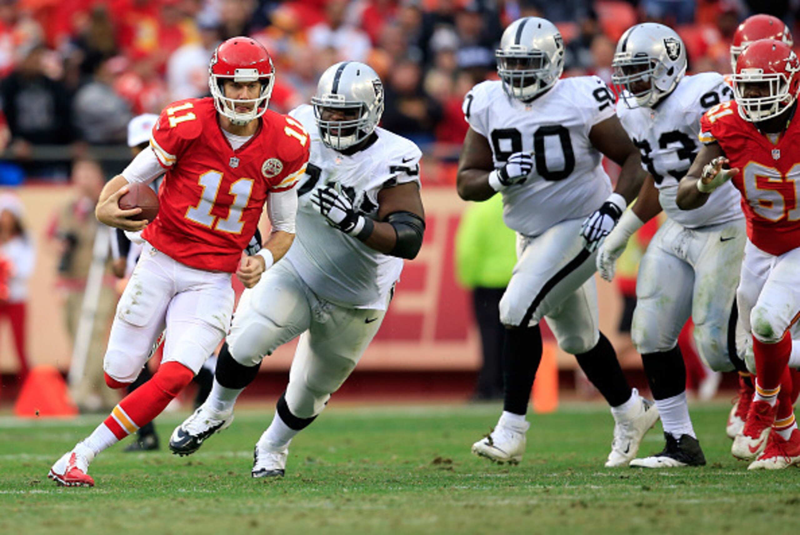 KANSAS CITY, MO - DECEMBER 14: Alex Smith #11 of the Kansas City Chiefs scrambles away from the Oakland Raiders defense during the game at Arrowhead Stadium on December 14, 2014 in Kansas City, Missouri. (Photo by Jamie Squire/Getty Images) KANSAS CITY, MO - DECEMBER 14: Alex Smith #11 of the Kansas City Chiefs scrambles away from the Oakland Raiders defense during the game at Arrowhead Stadium on December 14, 2014 in Kansas City, Missouri. (Photo by Jamie Squire/Getty Images)