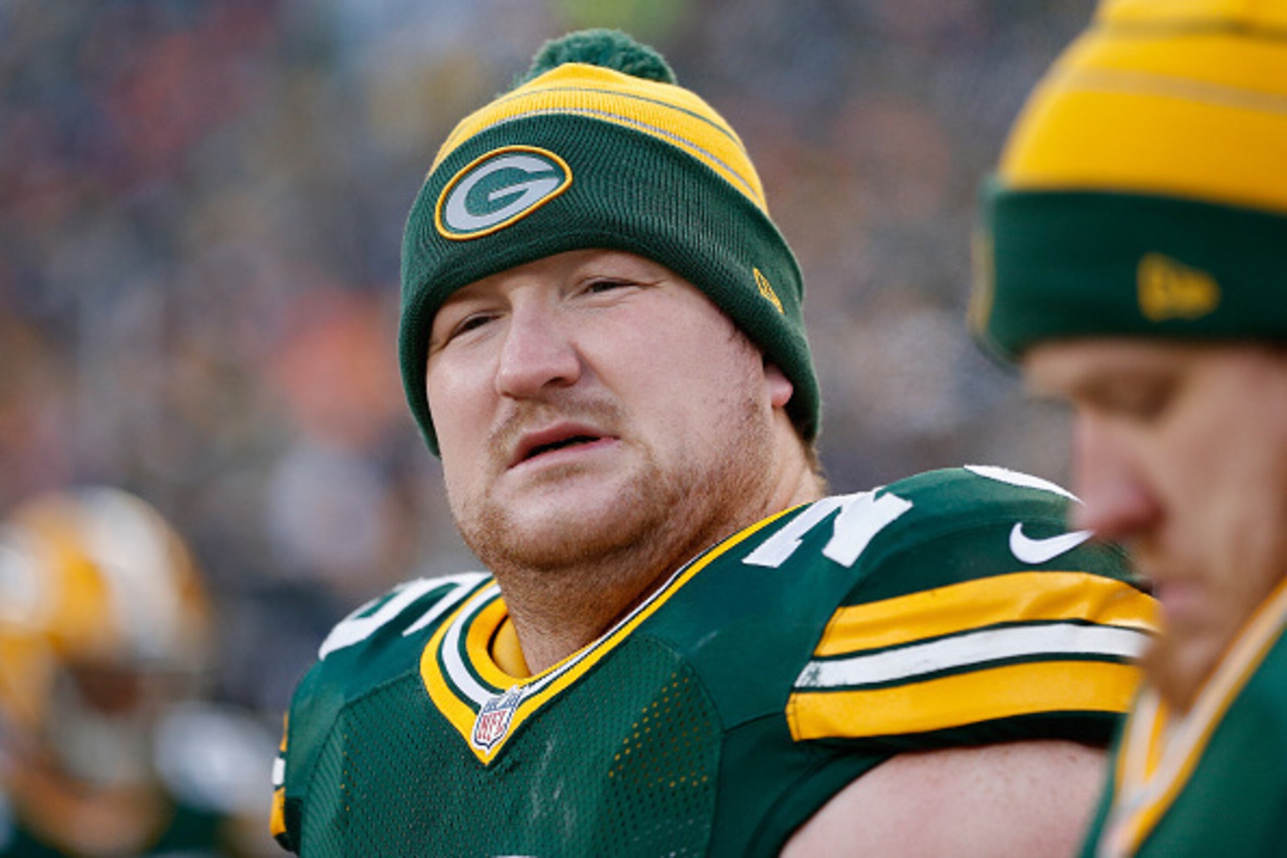GREEN BAY, WI - NOVEMBER 30:  Tackle Bryan Bulaga #75 of the Green Bay Packers on the sidelines during the NFL game against the New England Patriots at Lambeau Field on November 30, 2014 in Green Bay, Wisconsin. The Packers defeated the Patriots 26-21.  (