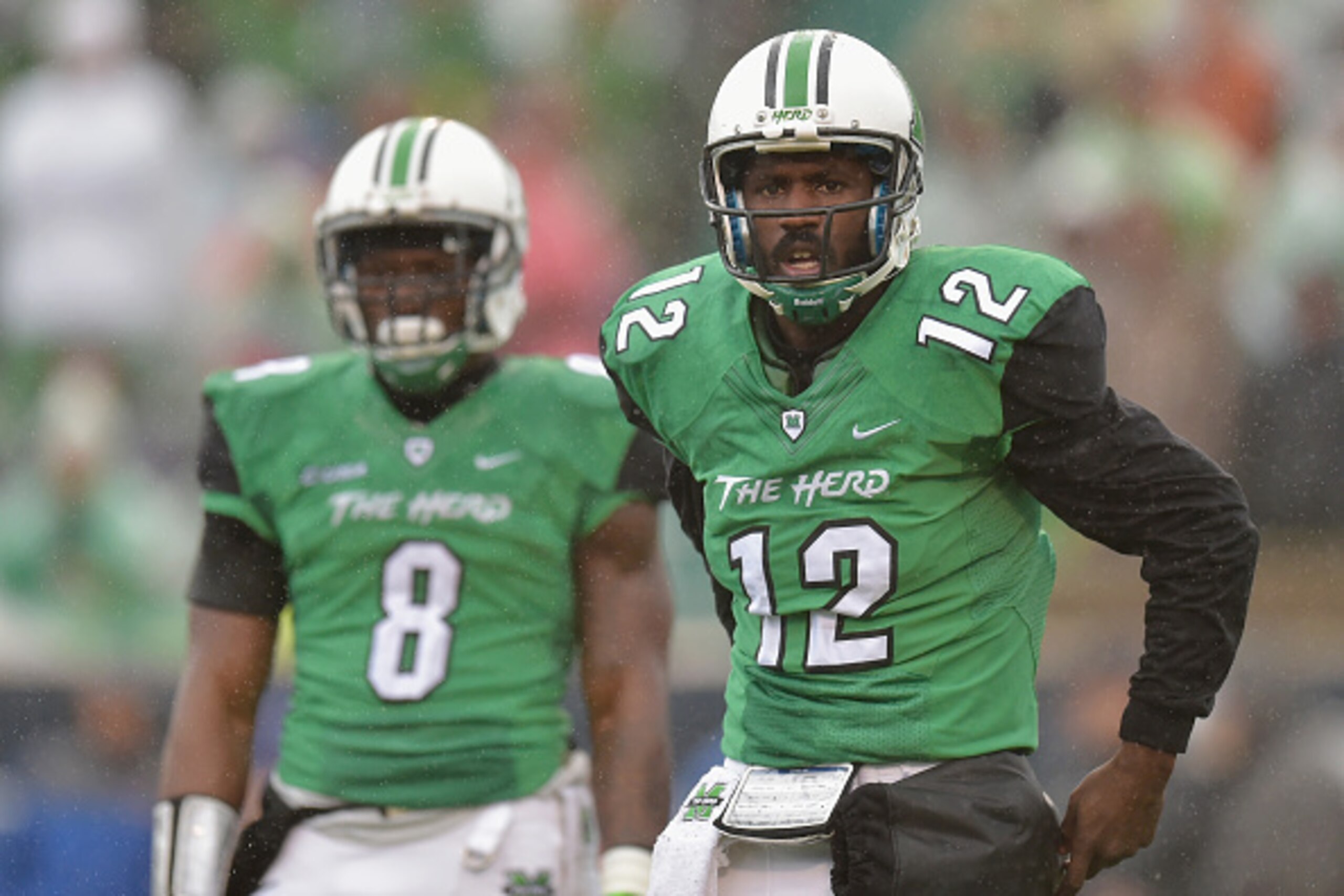 HUNTINGTON, WV - DECEMBER 06: Rakeem Cato #12 of the Marshall Thundering Herd looks towards the sideline during the first quarter against the Louisiana Tech Bulldogs at Joan C. Edwards Stadium during the Conference USA championship game on December 6, 201