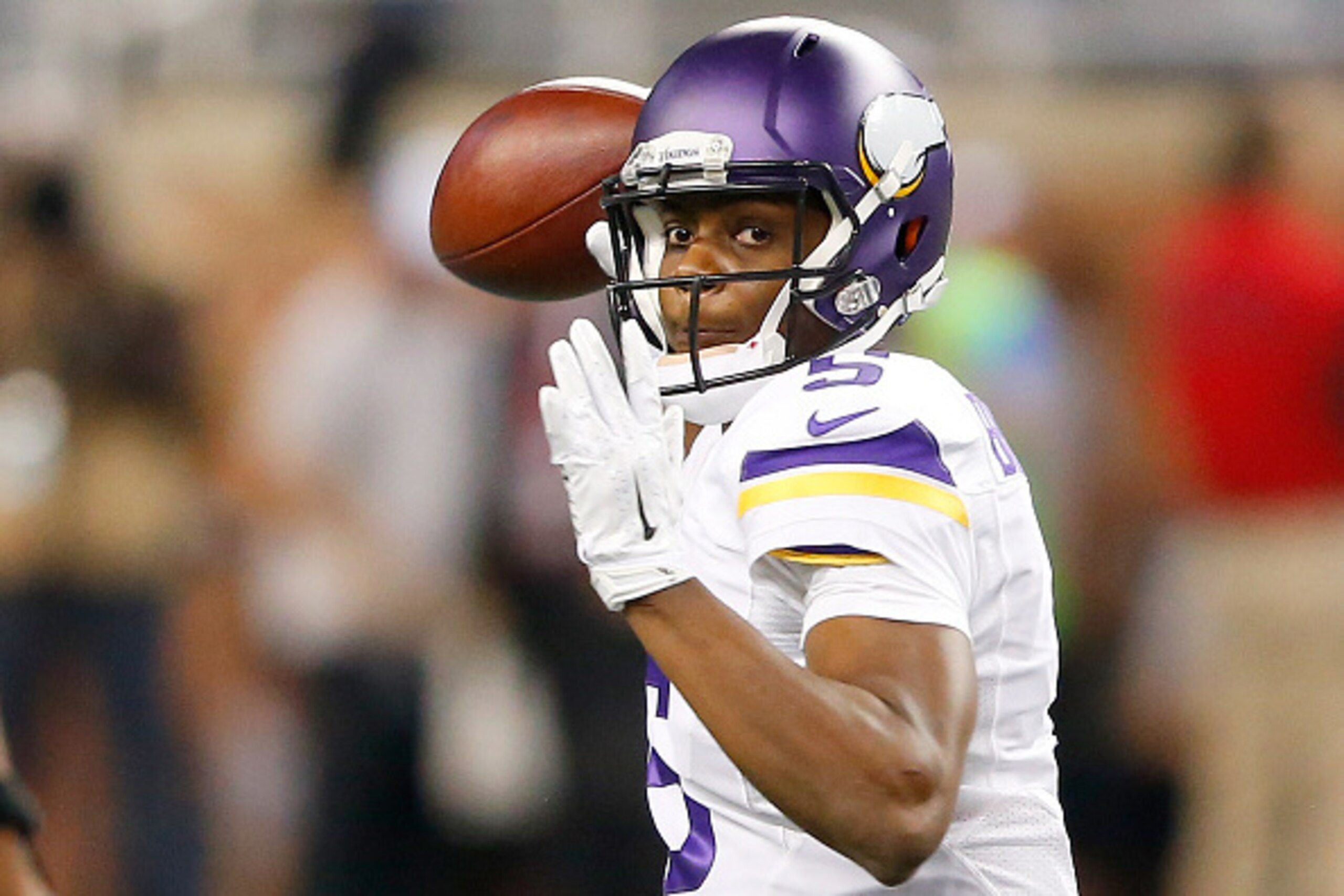 DETROIT, MI - DECEMBER 14: Teddy Bridgewater #5 of the Minnesota Vikings throws a first quarter pass against the Detroit Lions at Ford Field on December 14, 2014 in Detroit, Michigan. (Photo by Leon Halip/Getty Images)