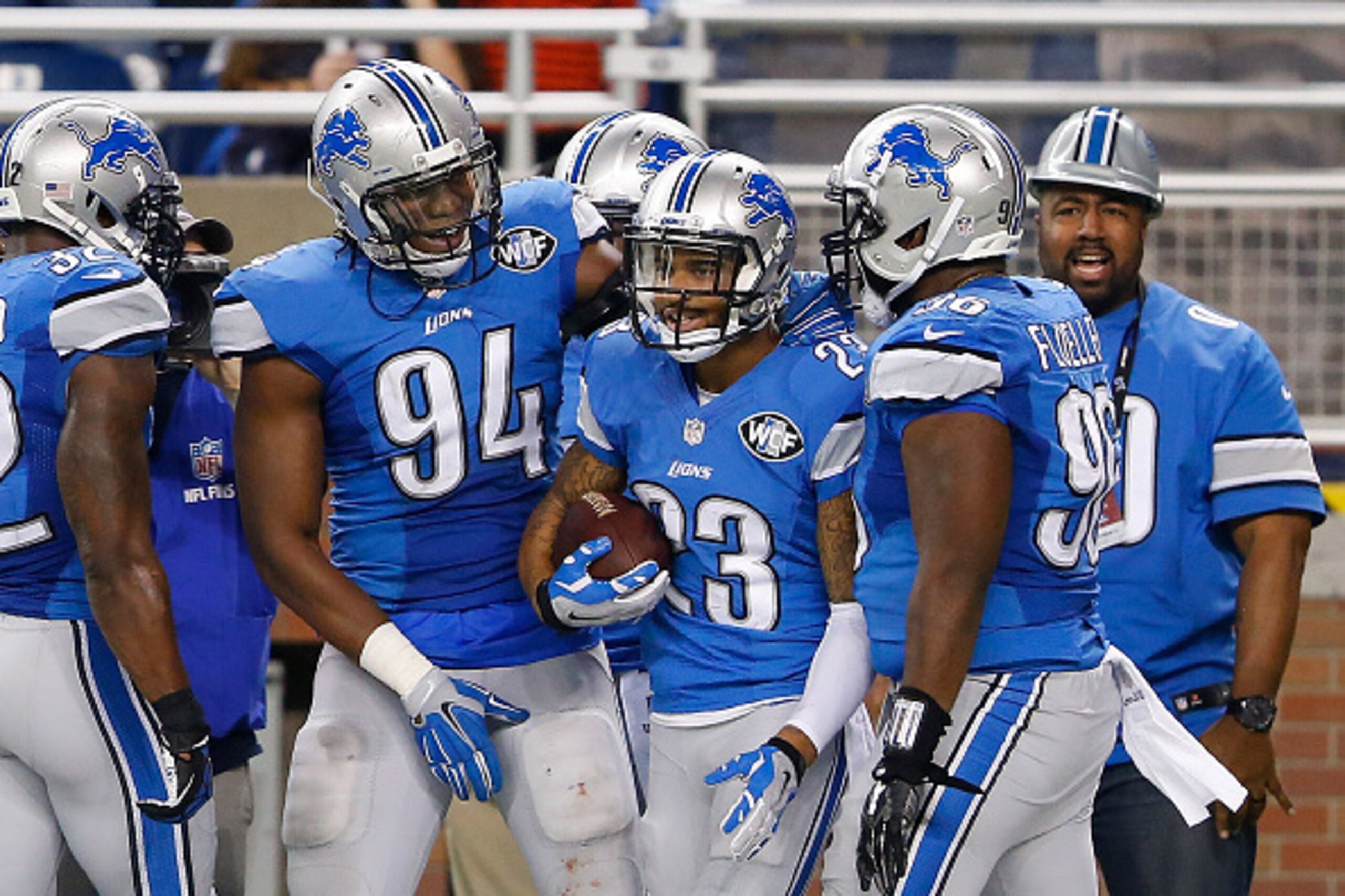 DETROIT, MI - DECEMBER 14: Darius Slay #23 of the Detroit Lions celebrates with teammates Ezekiel Ansah #94 and Andre Fluellen #96 after intercepting a pass from quarterback Teddy Bridgewater #5 of the Minnesota Vikings (not in photo) during the second qu