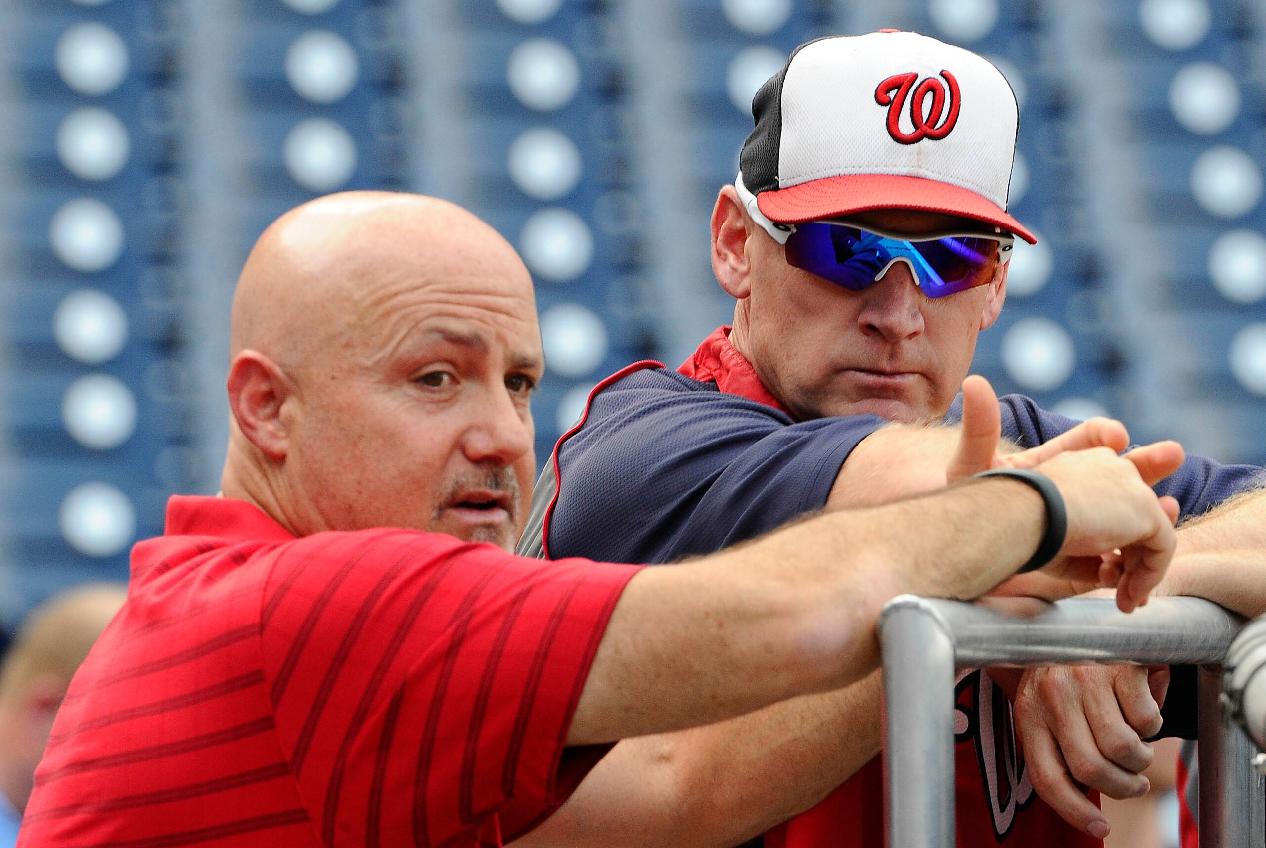 Jul 18, 2014; Washington, DC, USA; Washington Nationals manager Matt Williams talks with general manager Mike Rizzo before the game against the Milwaukee Brewers at Nationals Park. Mandatory Credit: Brad Mills-USA TODAY Sports