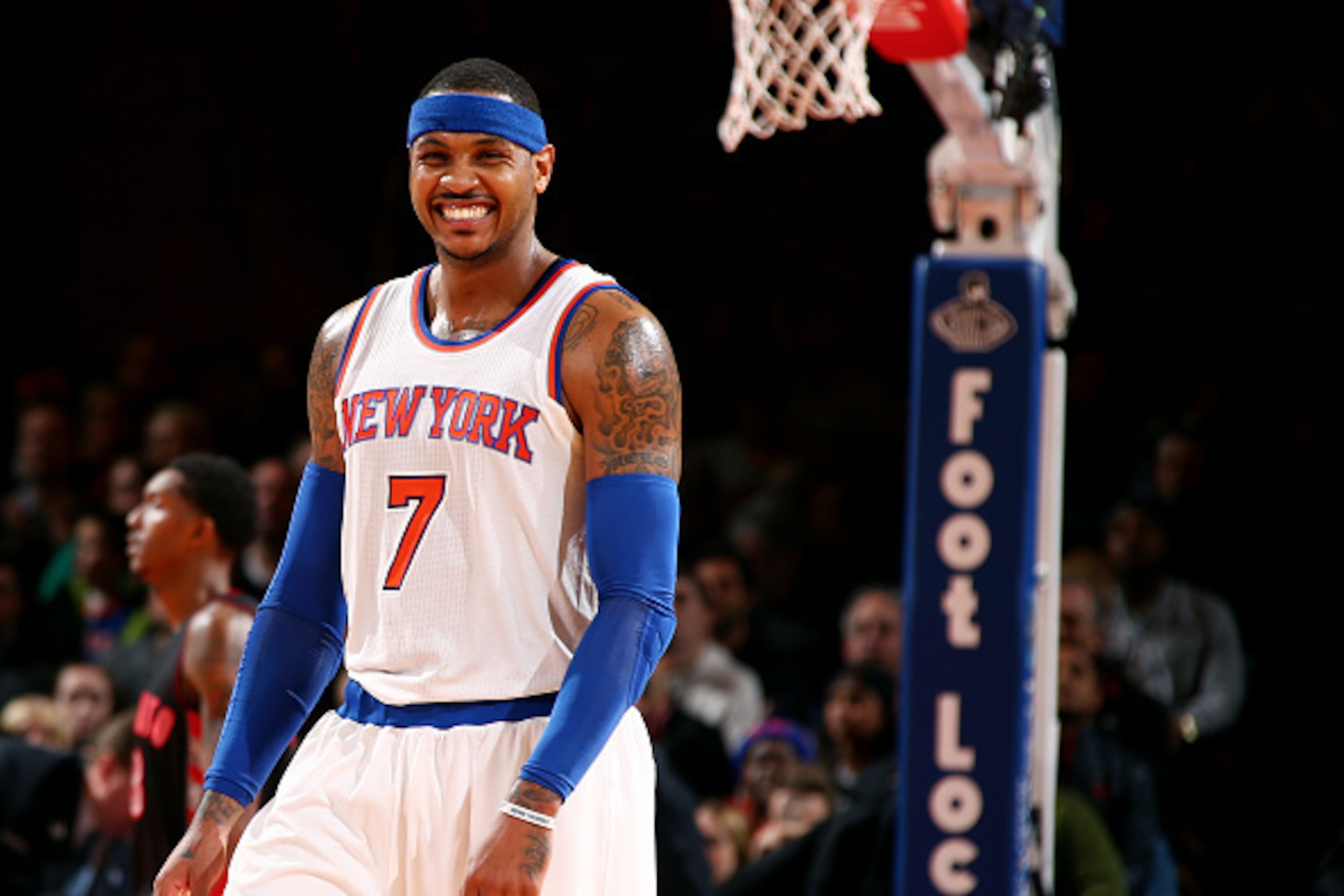NEW YORK, NY - DECEMBER 14: Carmelo Anthony #7 of the New York Knicks smiles during a game against the Toronto Raptors at Madison Square Garden on December 14, 2014 in New York City, New York. NOTE TO USER: User expressly acknowledges and agrees that, by 