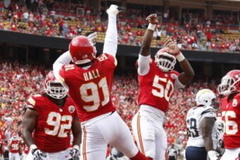 KANSAS CITY, MO - SEPTEMBER 30: Tamba Hali #91 and Justin Houston #50 of the Kansas City Chiefs celebrate after a sack against the San Diego Chargers during the game at Arrowhead Stadium on September 30, 2012 in Kansas City, Missouri. The Chargers won 37-