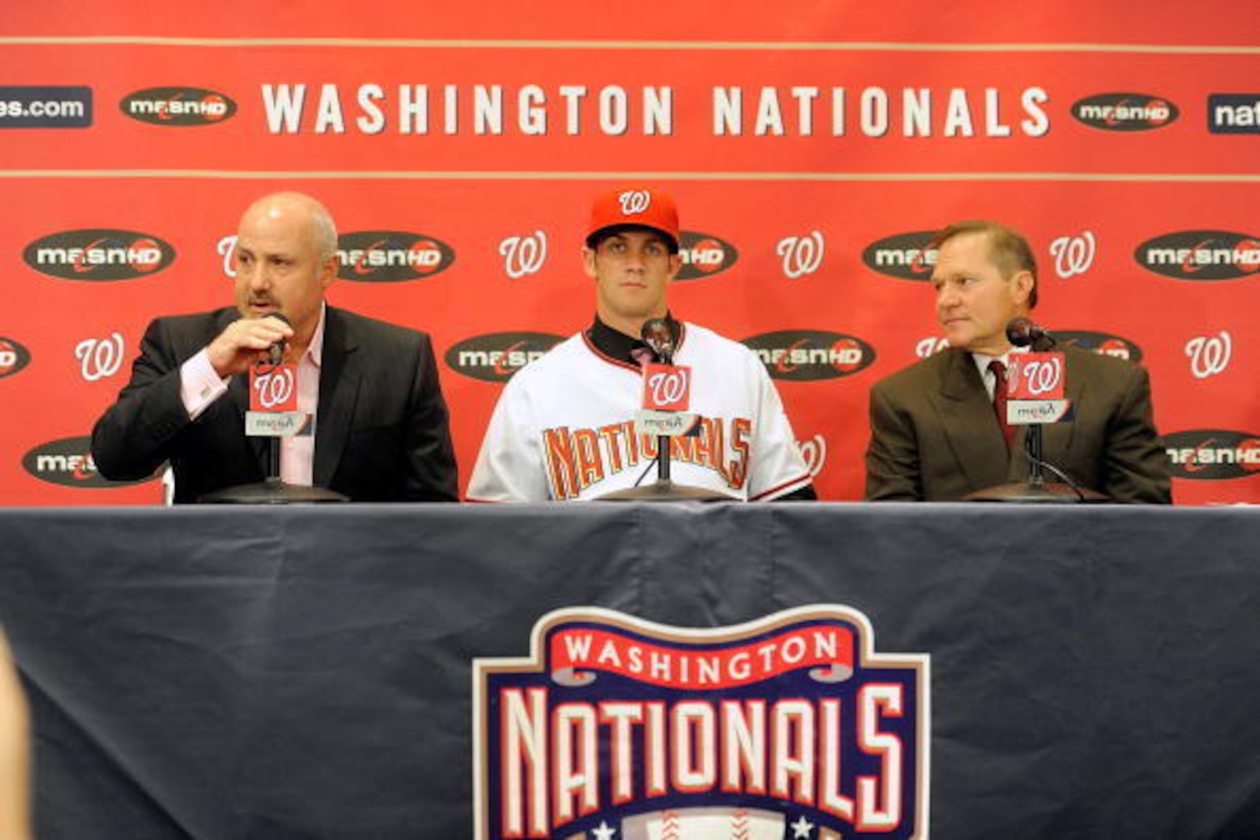 WASHINGTON - AUGUST 26:  General Manger Mike Rizzo, Bryce Harper #34 of the Washington Nationals and Scott Boras talk to the media during a press conference at Nationals Park on August 26, 2010 in Washington, DC.  (Photo by Greg Fiume/Getty Images)