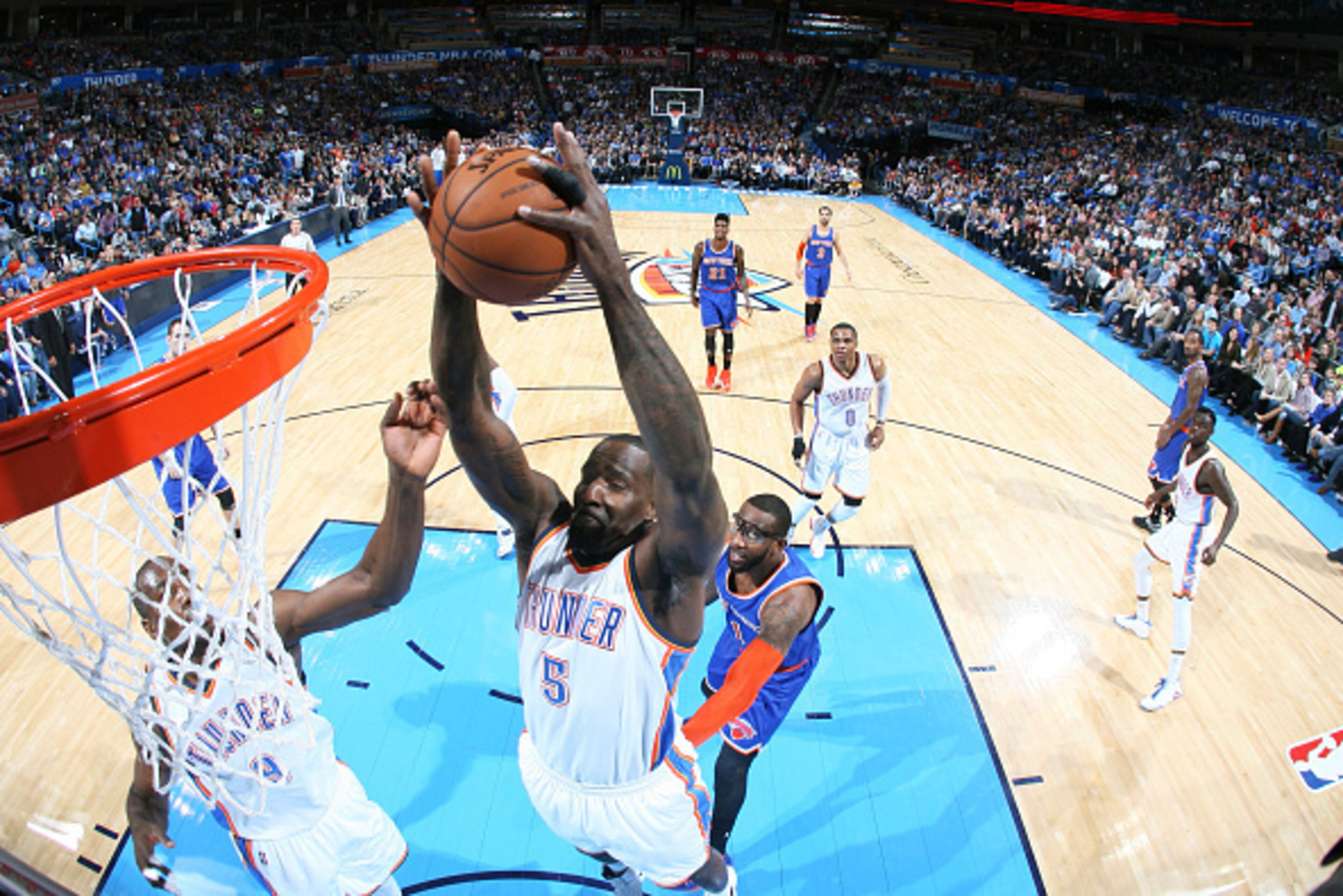 OKLAHOMA CITY, OK - NOVEMBER 28: Kendrick Perkins #5 of the Oklahoma City Thunder grabs a rebound against the New York Knicks on November 28, 2014 in Oklahoma City, Oklahoma. NOTE TO USER: User expressly acknowledges and agrees that, by downloading and/or