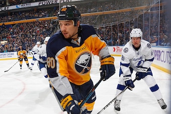 BUFFALO, NY - DECEMBER 02: Chris Stewart #80 of the Buffalo Sabres looks to make a play against Anton Stralman #6 of the Tampa Bay Lightning on December 2, 2014 at the First Niagara Center in Buffalo, New York.  (Photo by Bill Wippert/NHLI via Getty Image