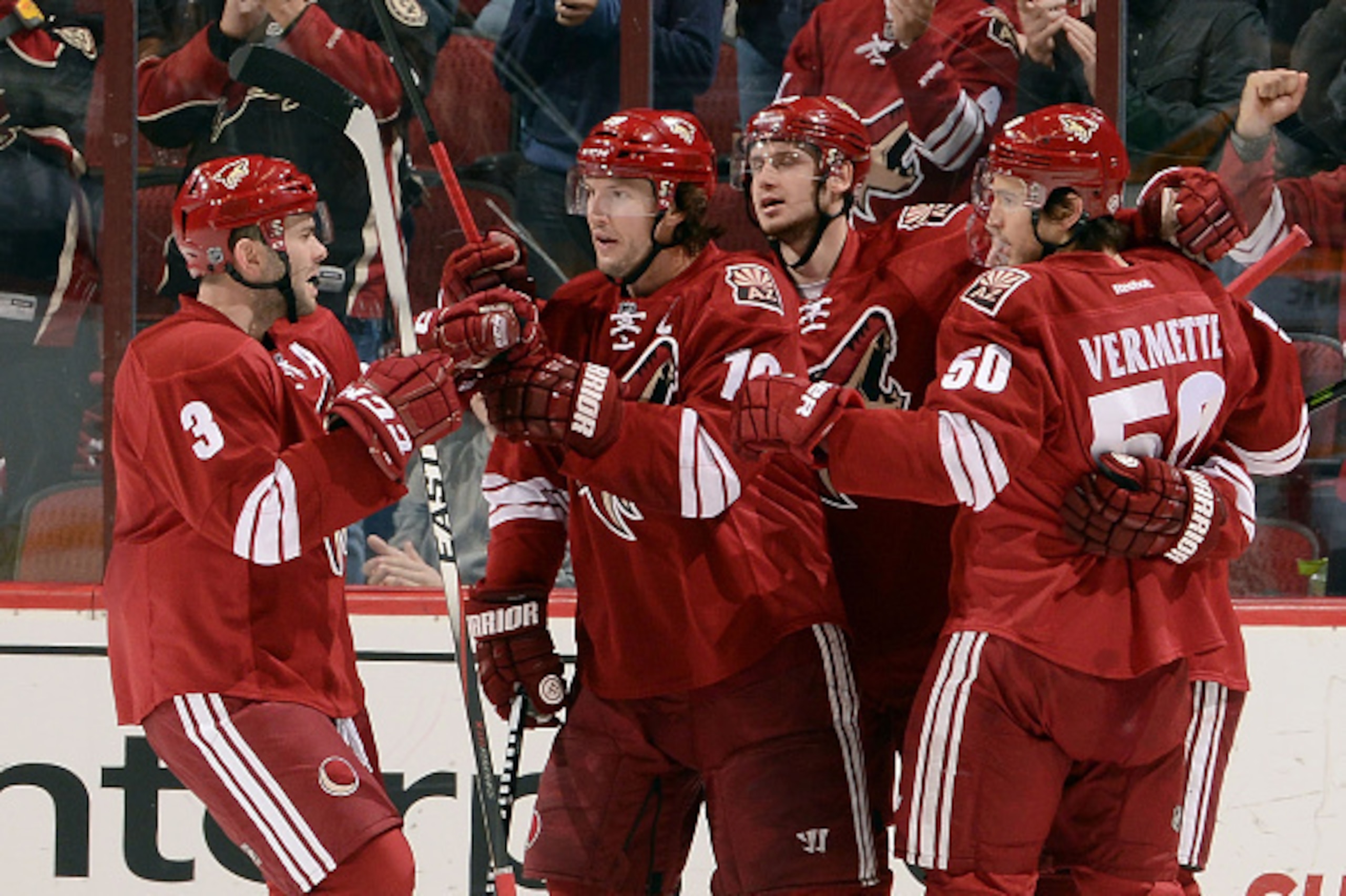 GLENDALE, AZ - DECEMBER 11:  Keith Yandle #3, Shane Doan #19, Oliver Ekman-Larsson #23, and Antoine Vermette #50 of the Arizona Coyotes celebrate a first period goal against the Nashville Predators at Gila River Arena on December 11, 2014 in Glendale, Ari