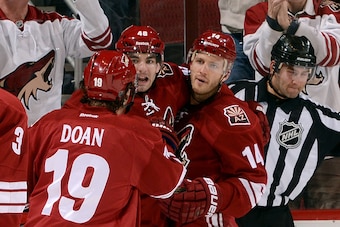 GLENDALE, AZ - DECEMBER 06:  Shane Doan #19, Jordan Martinook #48, and Joe Vitale #14 of the Arizona Coyotes celebrate Vitale's first period goal against the Boston Bruins at Gila River Arena on December 6, 2014 in Glendale, Arizona.  (Photo by Norm Hall/