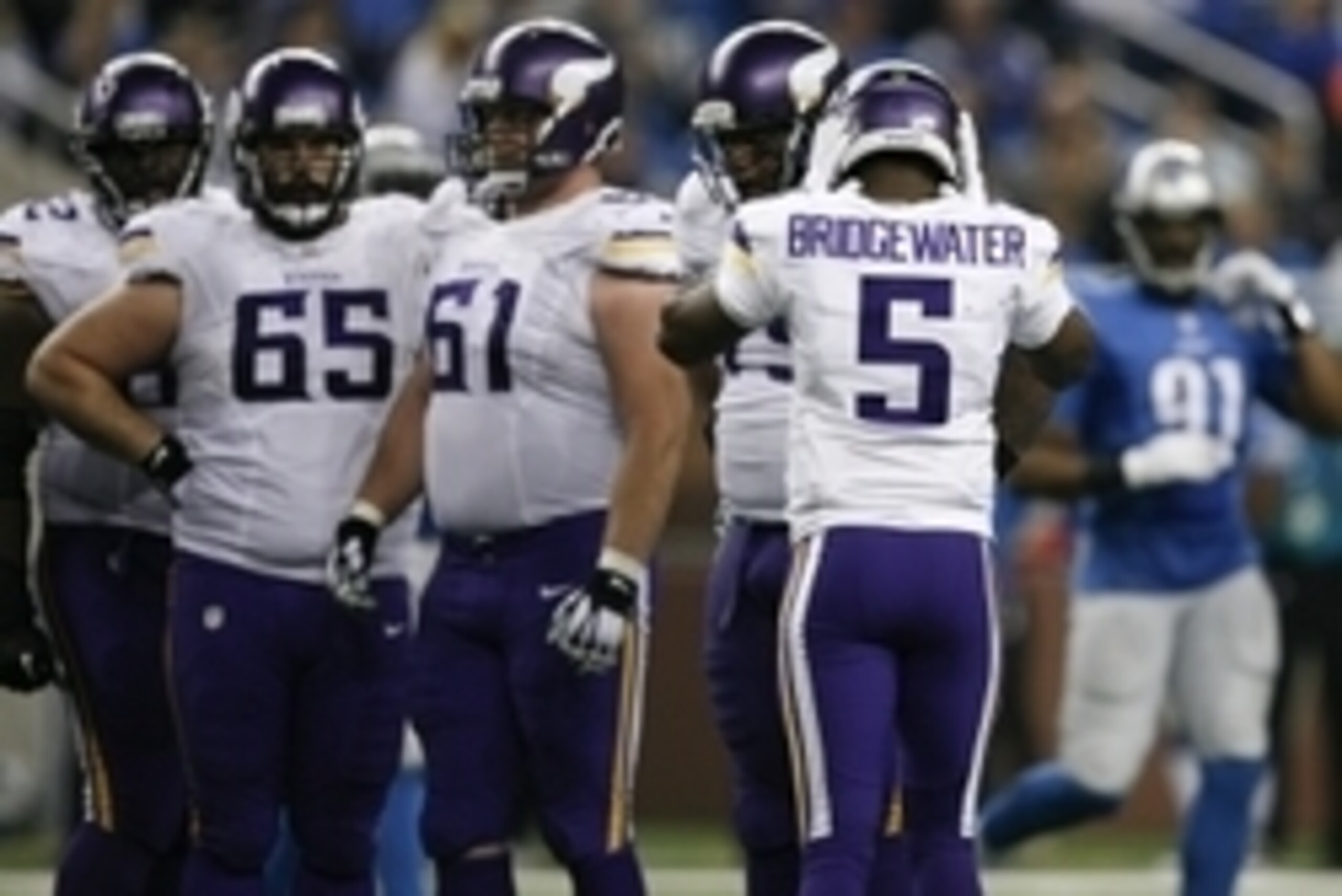 Dec 14, 2014; Detroit, MI, USA; Minnesota Vikings quarterback Teddy Bridgewater (5) tries to block out the crowd noise during the third quarter against the Detroit Lions at Ford Field. Lions win 16-14. Mandatory Credit: Raj Mehta-USA TODAY Sports