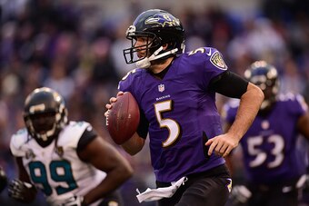 BALTIMORE, MD - DECEMBER 14: Quarterback Joe Flacco #5 of the Baltimore Ravens scrambles during the fourth quarter of a game against the Jacksonville Jaguars at M&T Bank Stadium on December 14, 2014 in Baltimore, Maryland.  (Photo by Patrick Smith/Getty I
